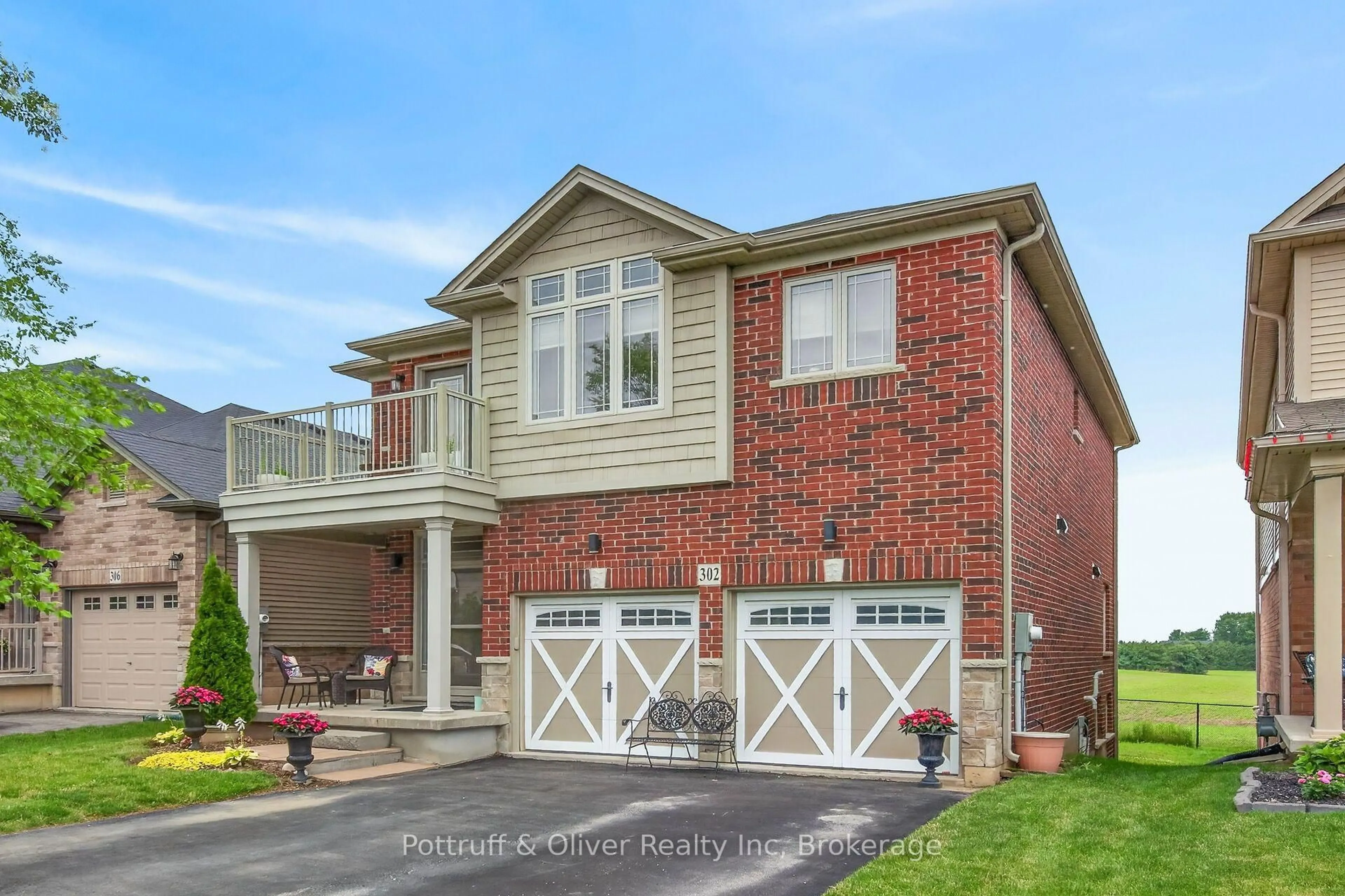 Home with brick exterior material, street for 302 Festival Way, Hamilton Ontario L0R 1C0