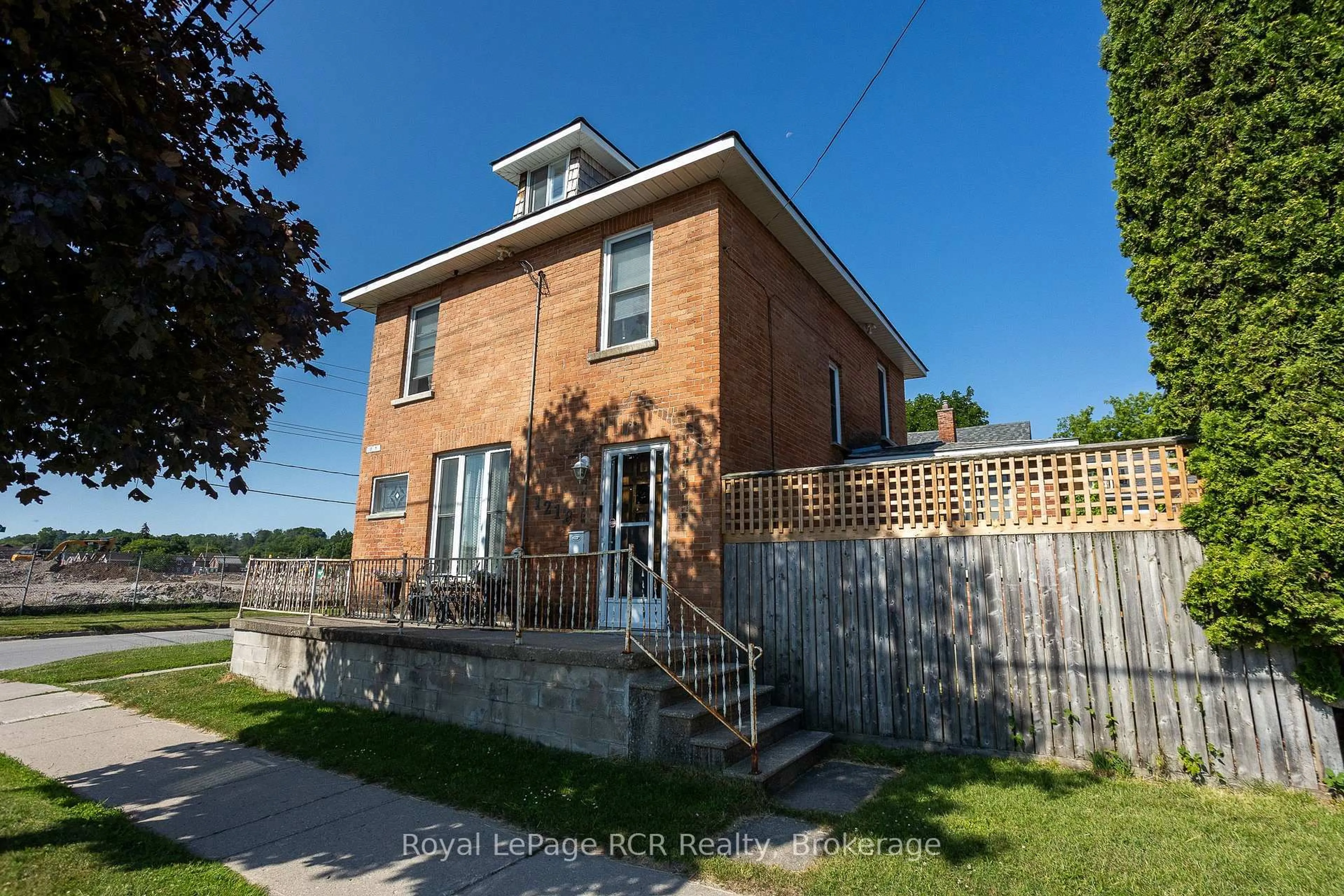 Home with brick exterior material, street for 1218 1st Ave, Owen Sound Ontario N4K 4L1