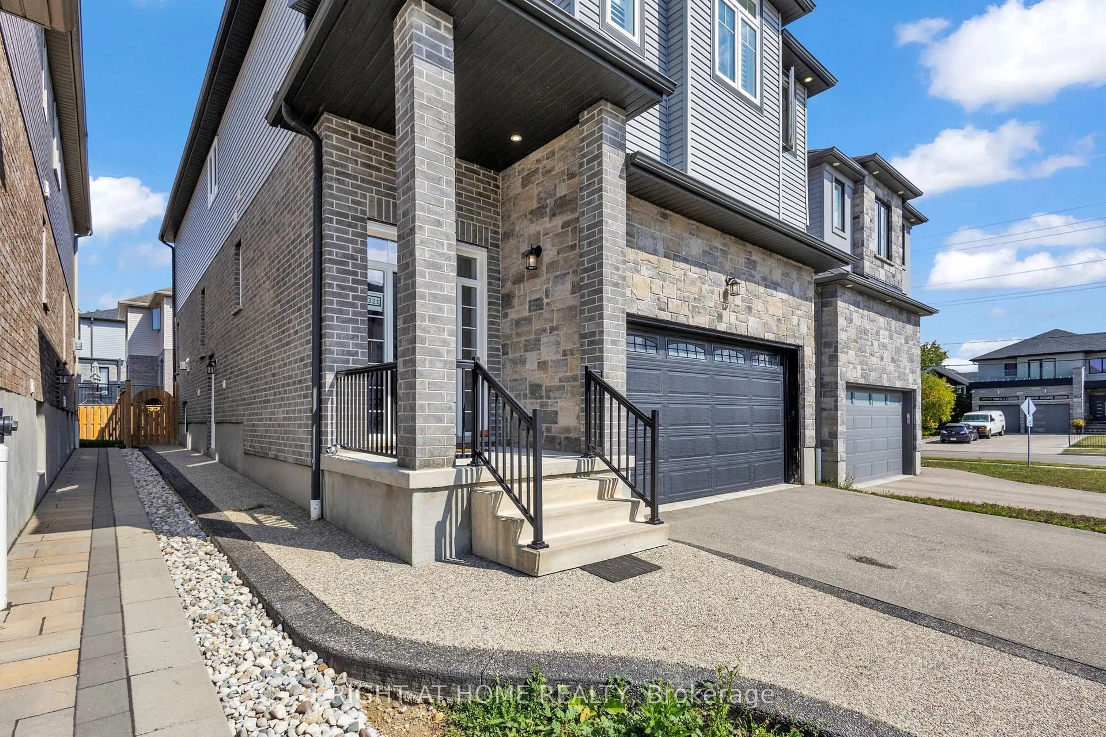 Home with brick exterior material, street for 321 Carriage Way, Waterloo Ontario N2K 0C2