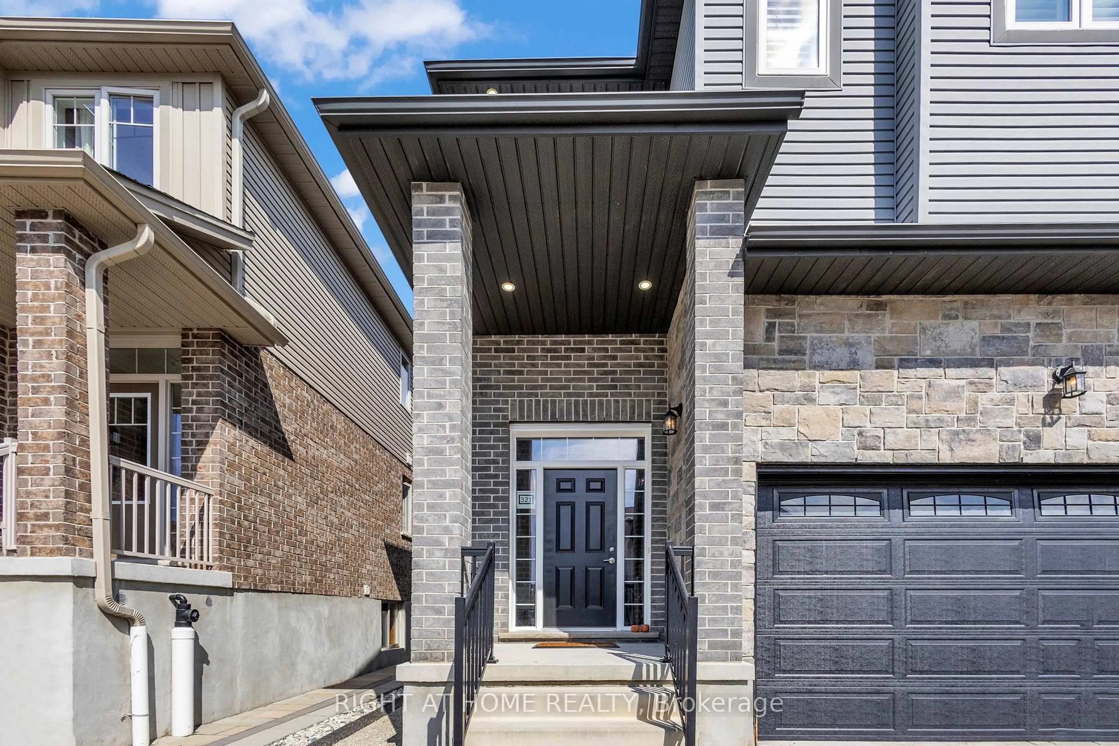 Home with brick exterior material, street for 321 Carriage Way, Waterloo Ontario N2K 0C2