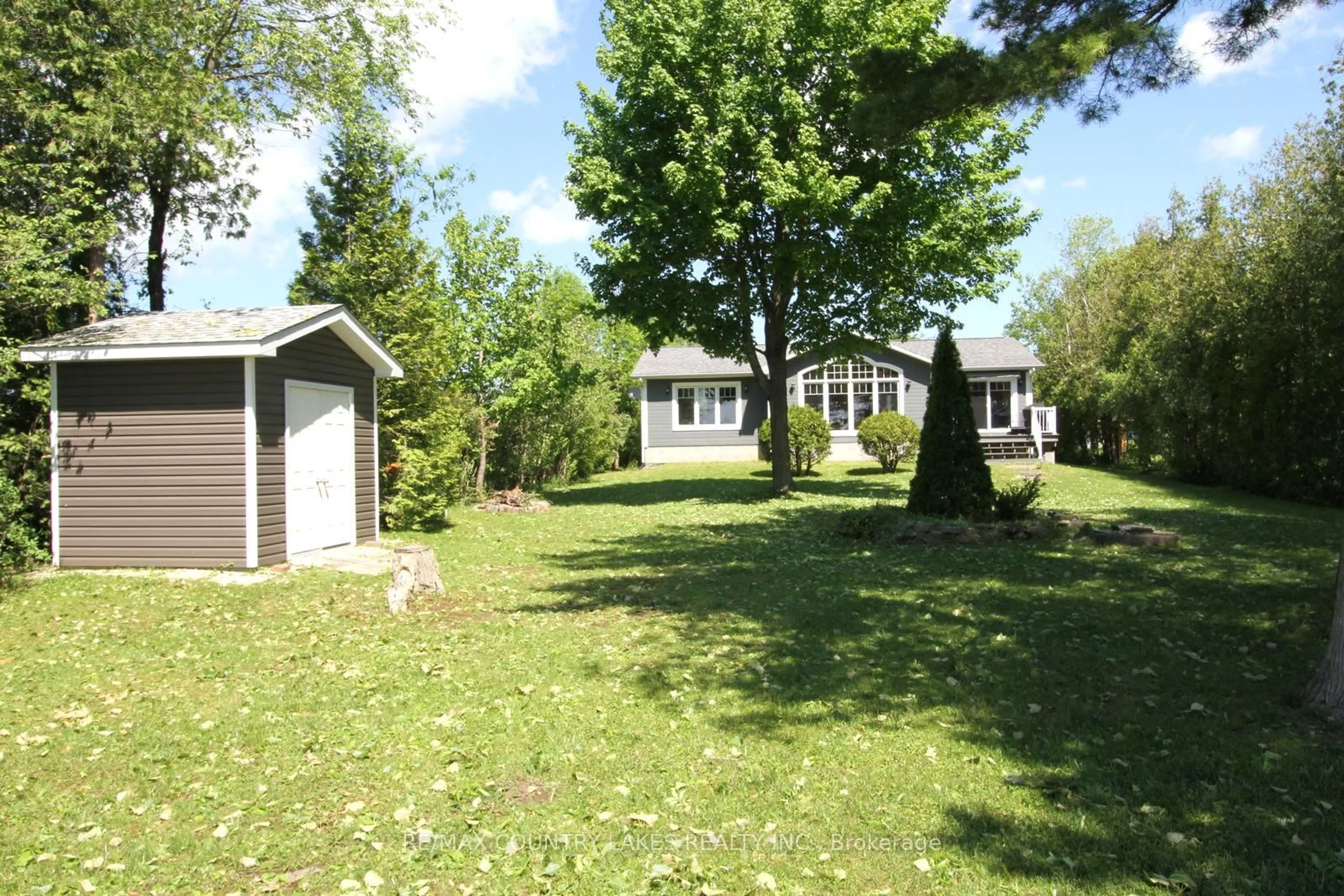 A pic from outside/outdoor area/front of a property/back of a property/a pic from drone, street for 275 McGuire Beach Rd, Kawartha Lakes Ontario K0M 2B0