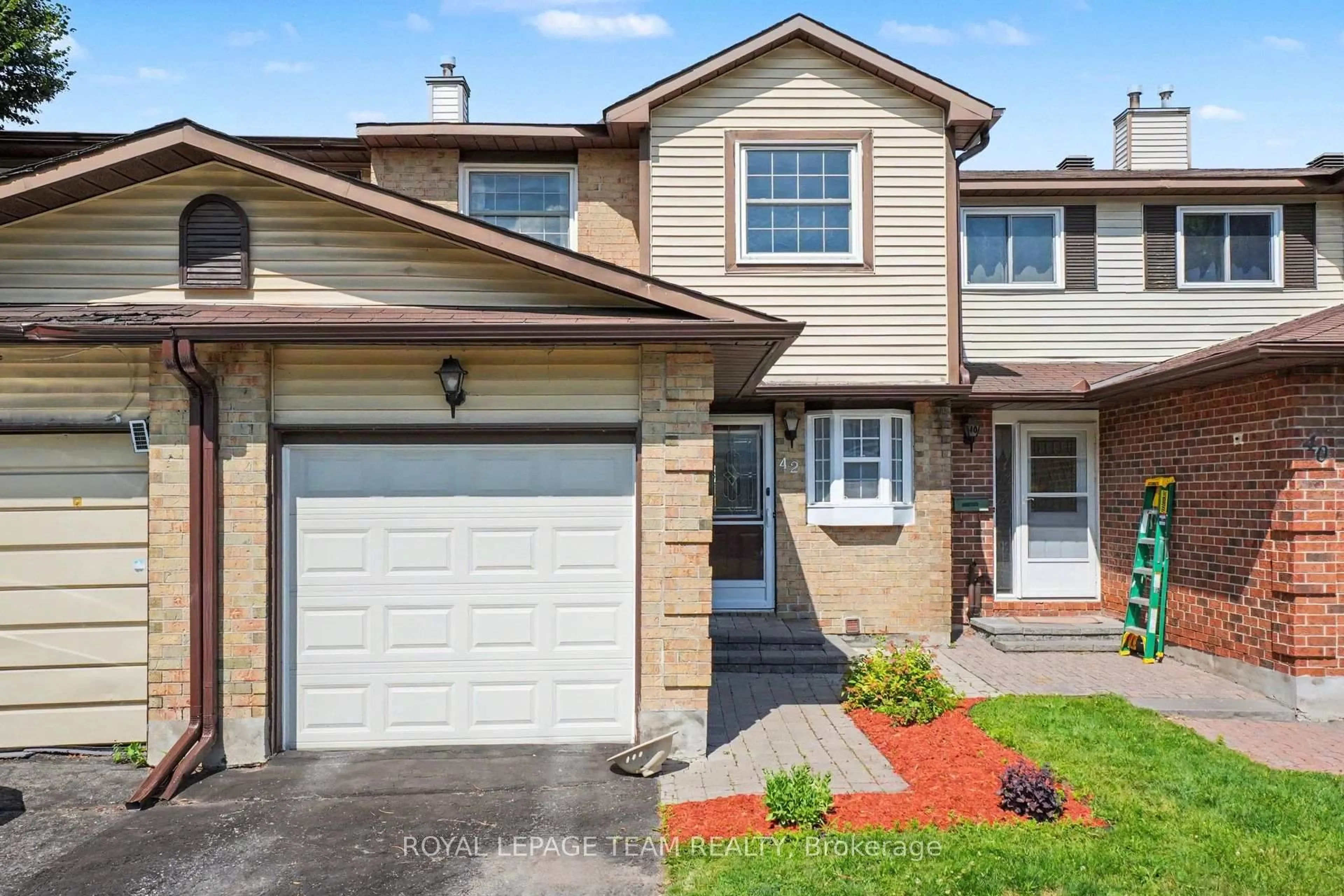Home with vinyl exterior material, street for 42 Sundback Lane, Kanata Ontario K2L 2W8