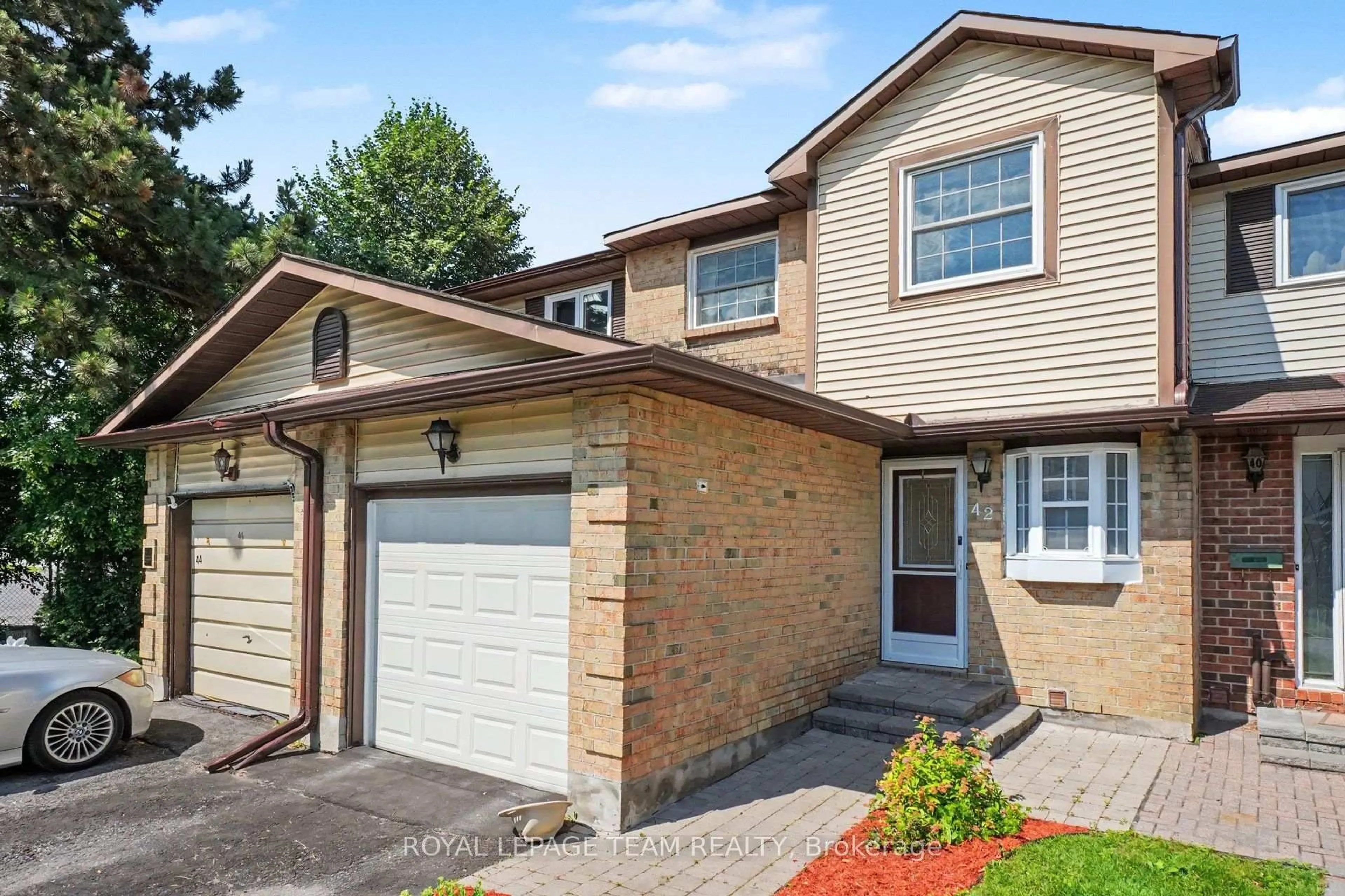 Home with brick exterior material, street for 42 Sundback Lane, Kanata Ontario K2L 2W8