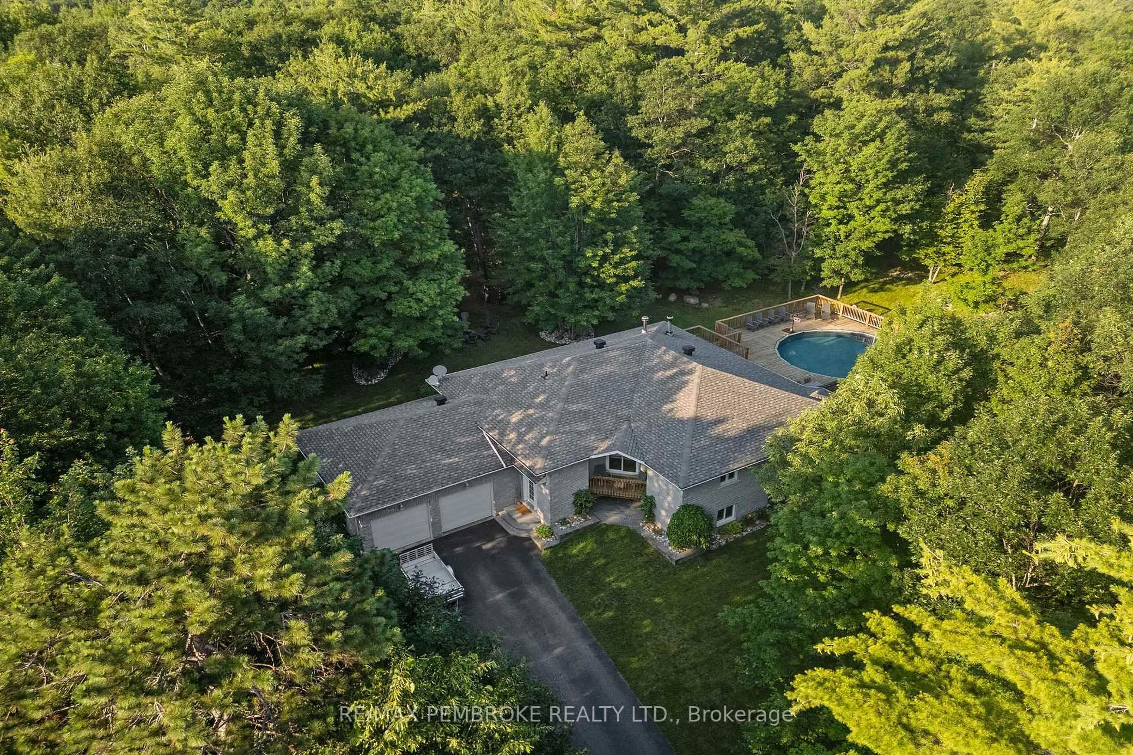 A pic from outside/outdoor area/front of a property/back of a property/a pic from drone, forest/trees view for 38 Rahns Rd, Pembroke Ontario K8A 6W8