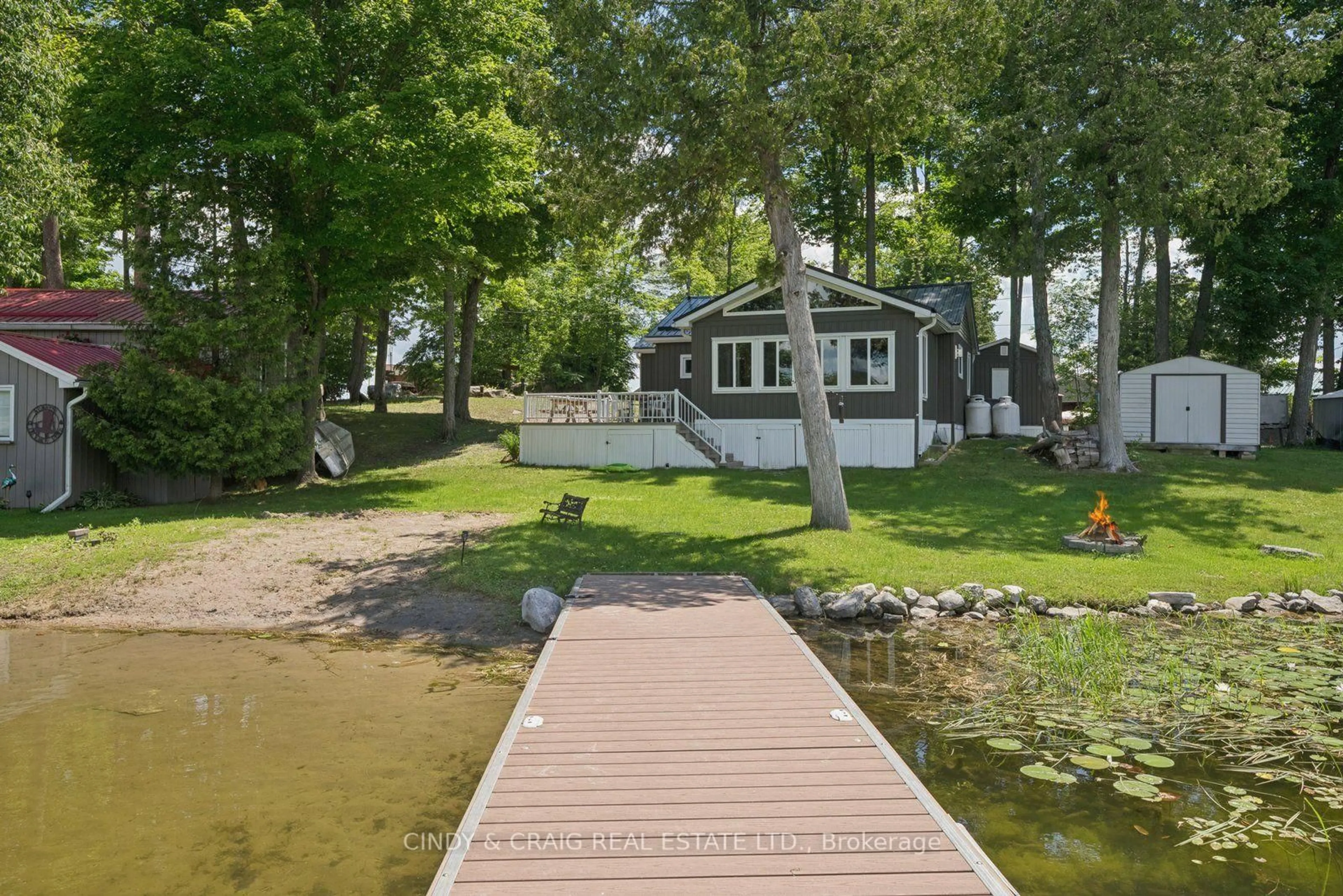 A pic from outside/outdoor area/front of a property/back of a property/a pic from drone, water/lake/river/ocean view for 213 Rollies Point Rd, Curve Lake First Nation 35 Ontario K0L 1R0