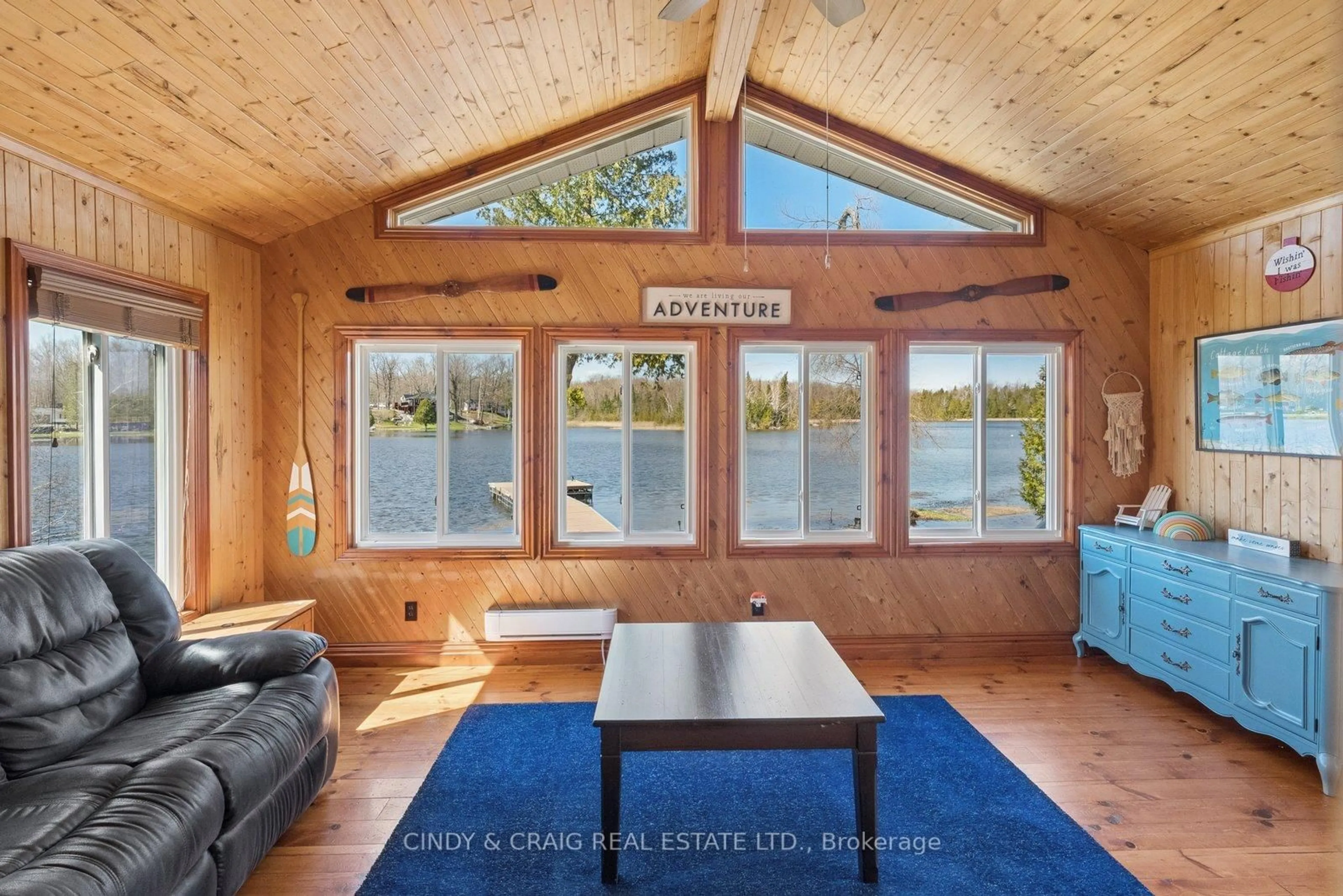 Living room with furniture, wood/laminate floor for 213 Rollies Point Rd, Curve Lake First Nation 35 Ontario K0L 1R0