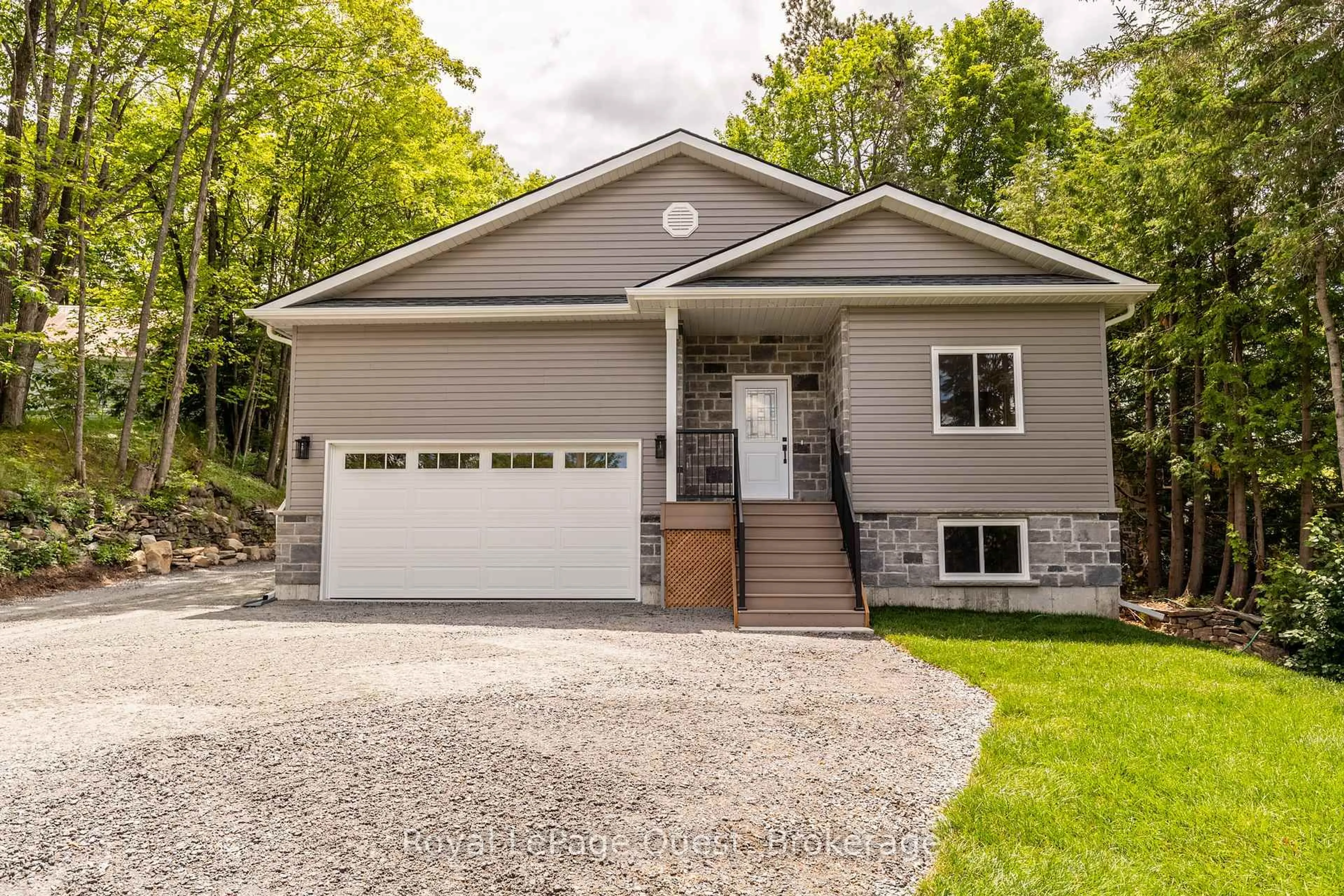 Home with vinyl exterior material, street for 57 West Rd, Huntsville Ontario P1H 1L4