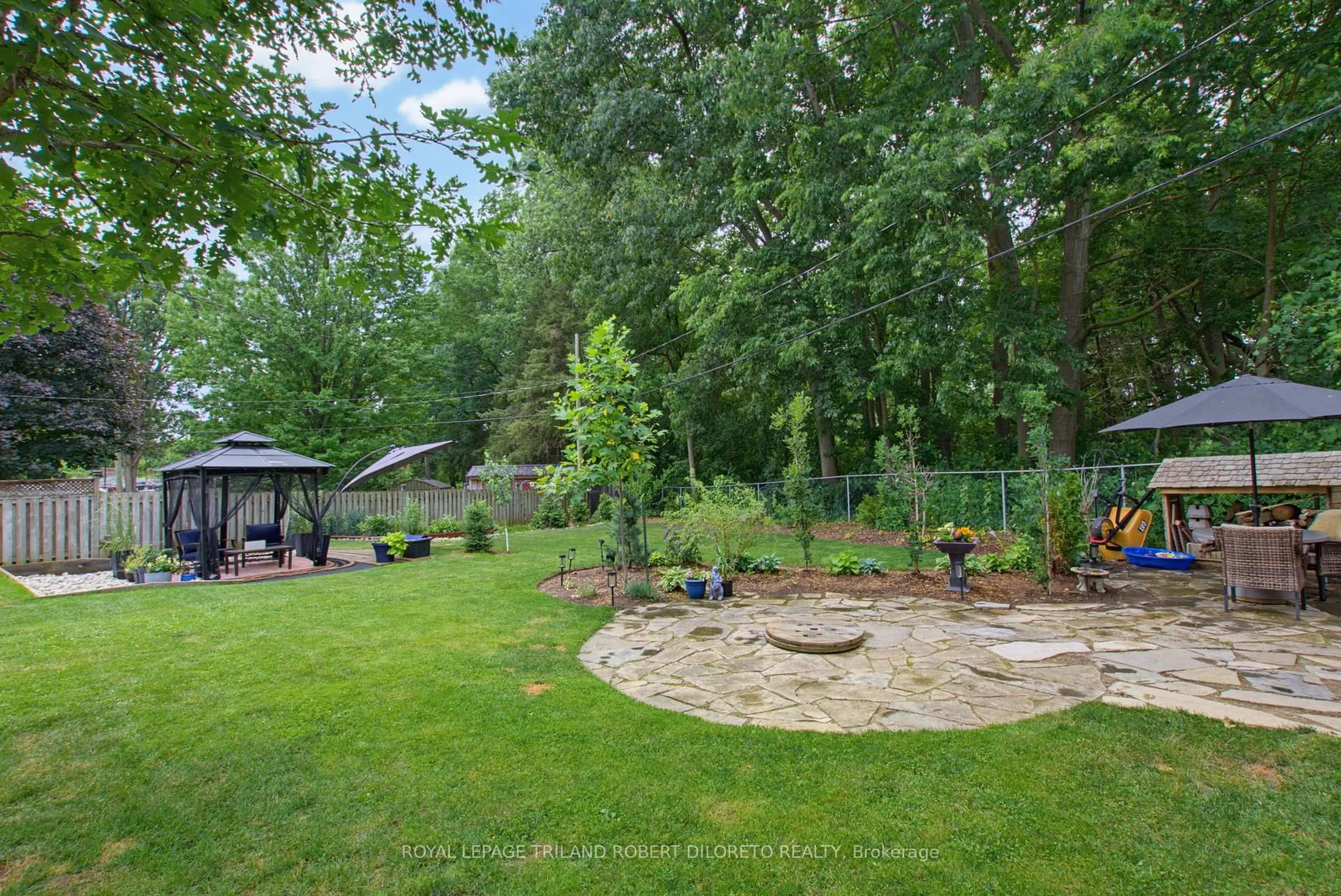 A pic from outside/outdoor area/front of a property/back of a property/a pic from drone, forest/trees view for 9 STRATHCONA Dr, London East Ontario N5W 1P7