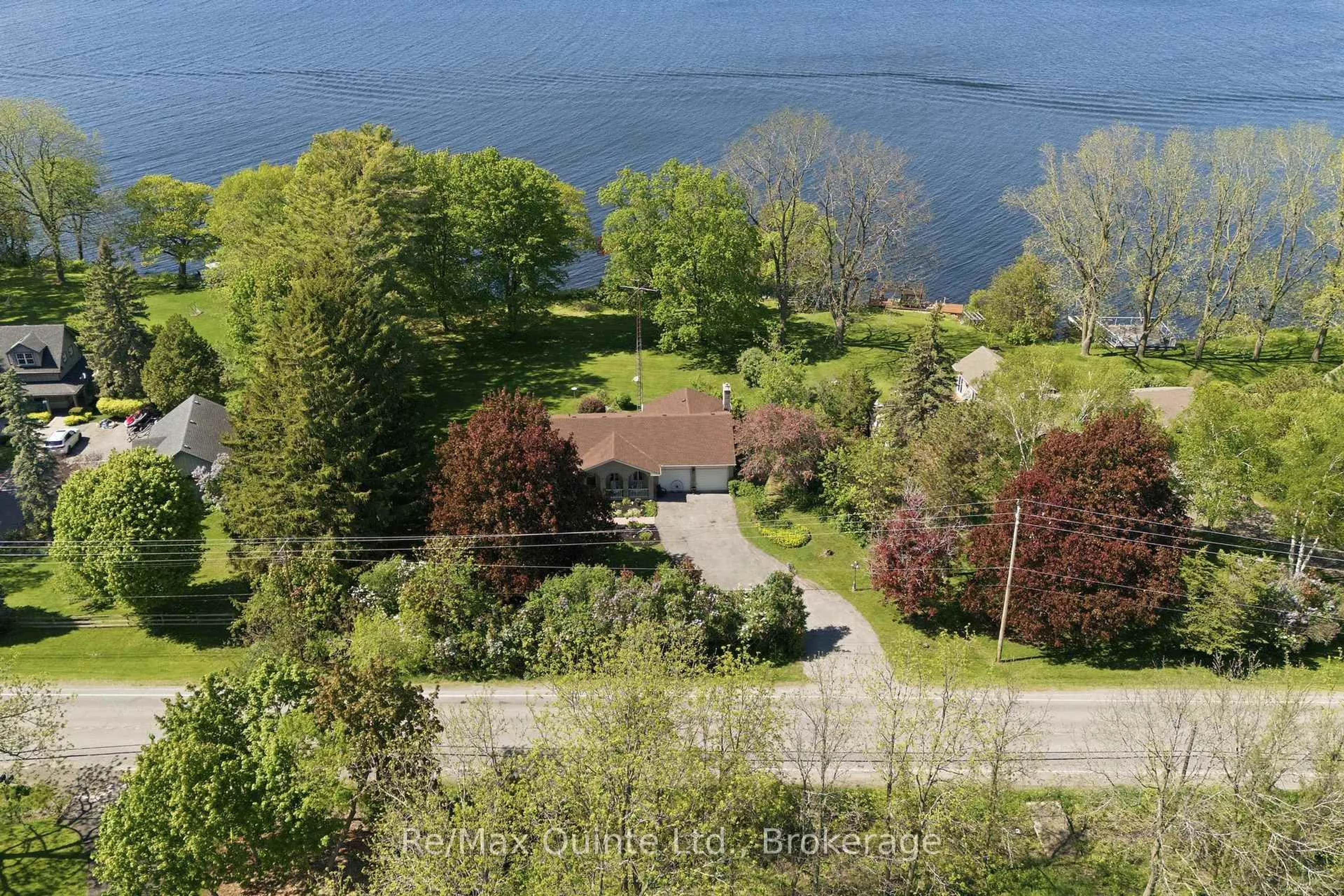 A pic from outside/outdoor area/front of a property/back of a property/a pic from drone, water/lake/river/ocean view for 1678 County Road 3, Prince Edward County Ontario K0K 1L0