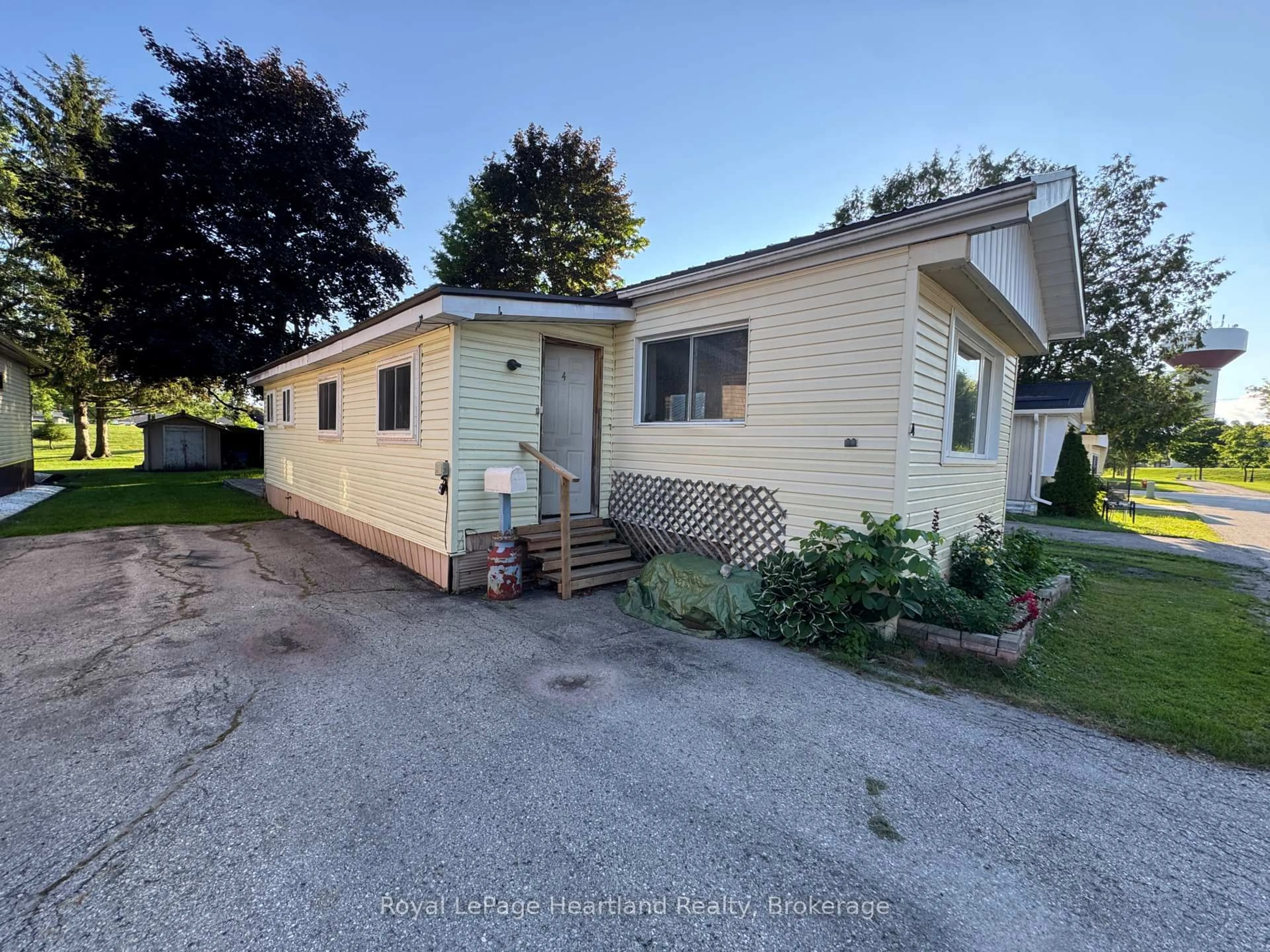 A pic from outside/outdoor area/front of a property/back of a property/a pic from drone, street for 4 Trailer Park Rd, Minto Ontario N0G 2P0