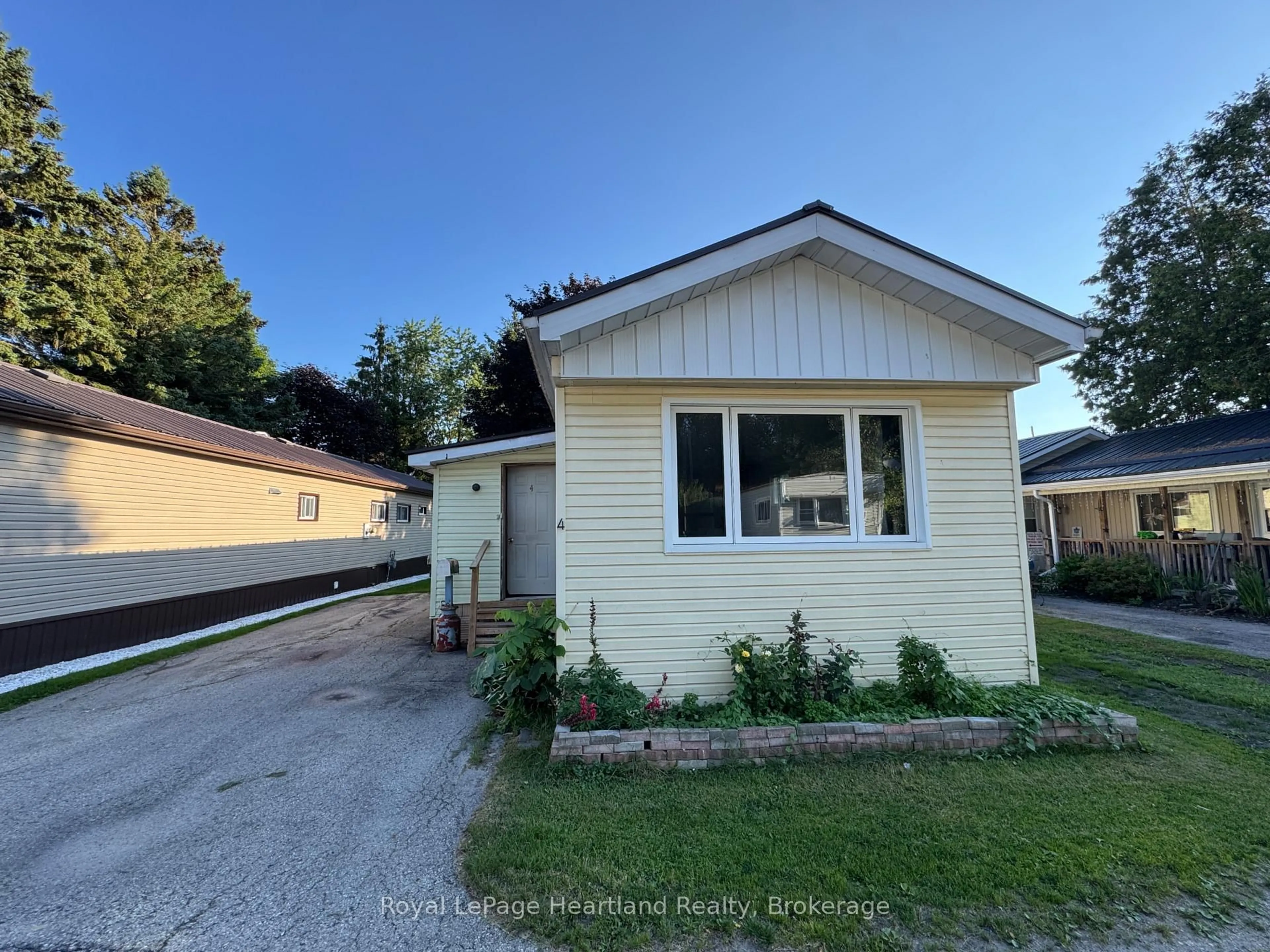 A pic from outside/outdoor area/front of a property/back of a property/a pic from drone, street for 4 Trailer Park Rd, Minto Ontario N0G 2P0