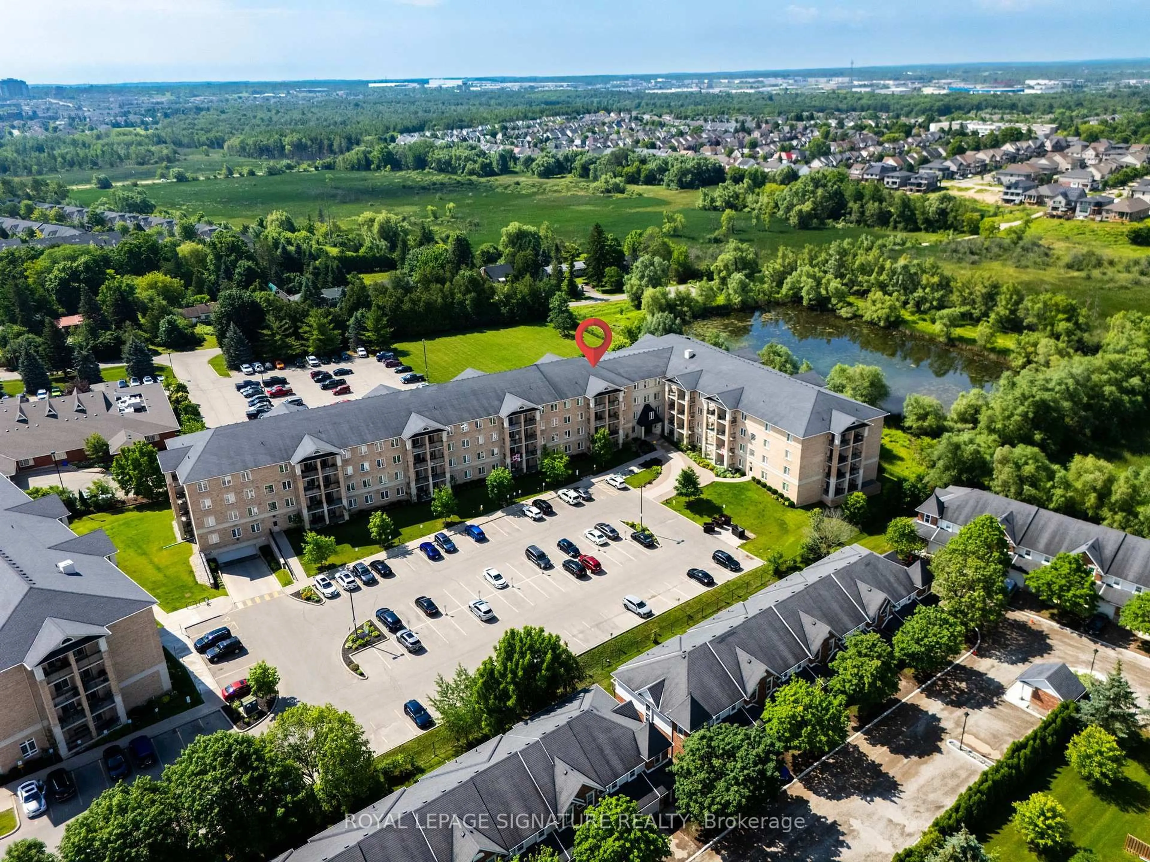 A pic from outside/outdoor area/front of a property/back of a property/a pic from drone, city buildings view from balcony for 1077 Gordon St #228, Guelph Ontario N1G 0E3