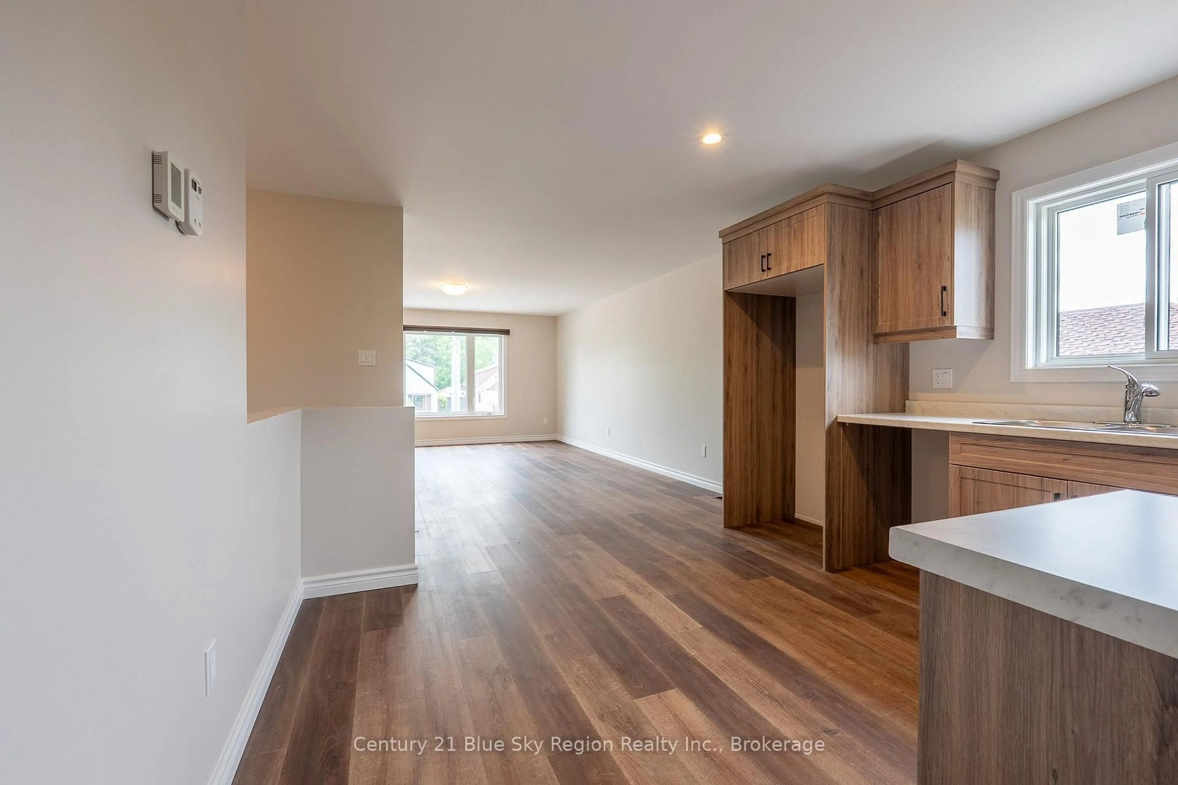 Open concept kitchen, wood/laminate floor for 1556 Fraser St, North Bay Ontario P1B 3Z2