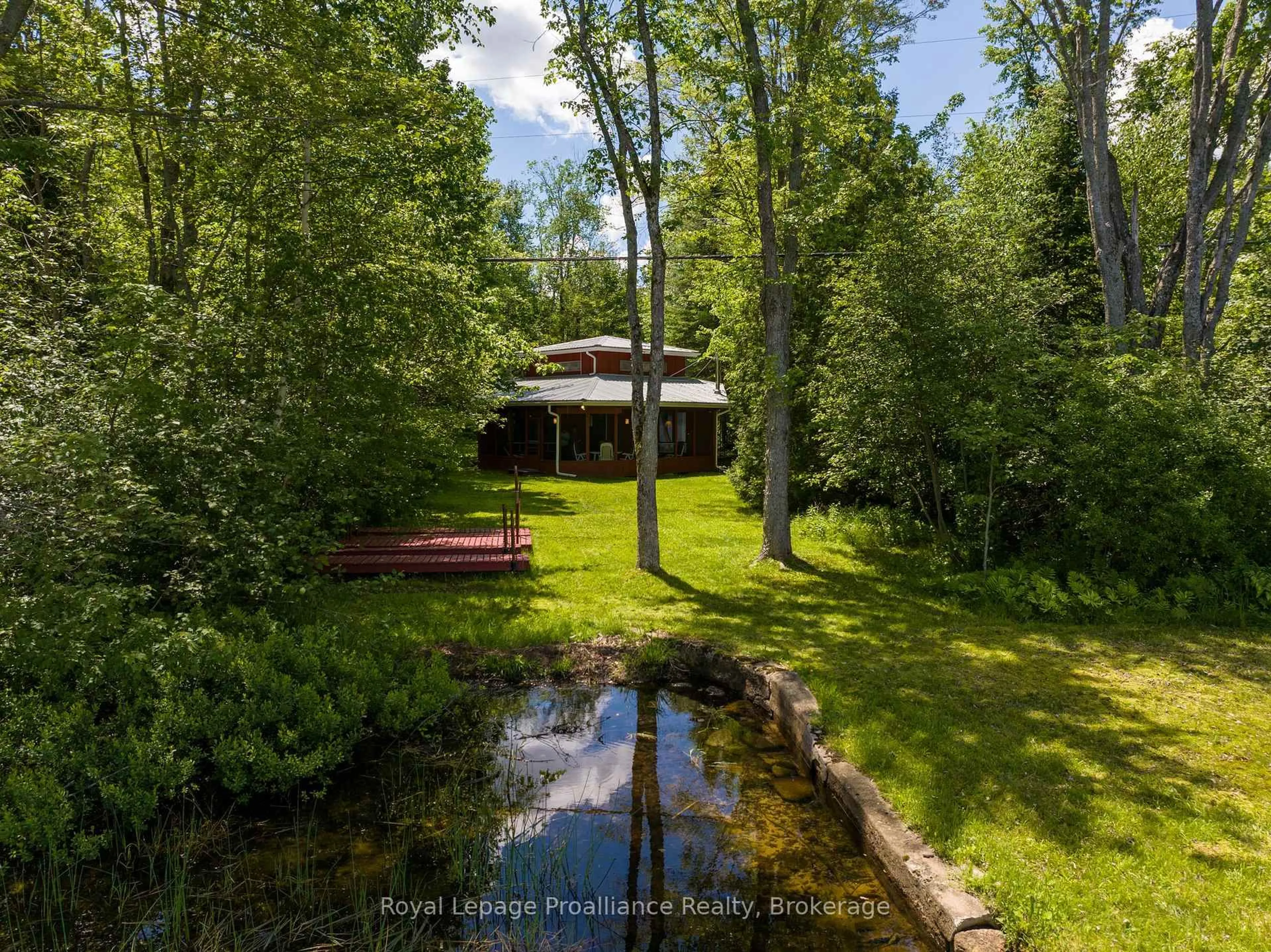 A pic from outside/outdoor area/front of a property/back of a property/a pic from drone, forest/trees view for 1185 Hughes Landing Rd, Cloyne Ontario K0H 1K0