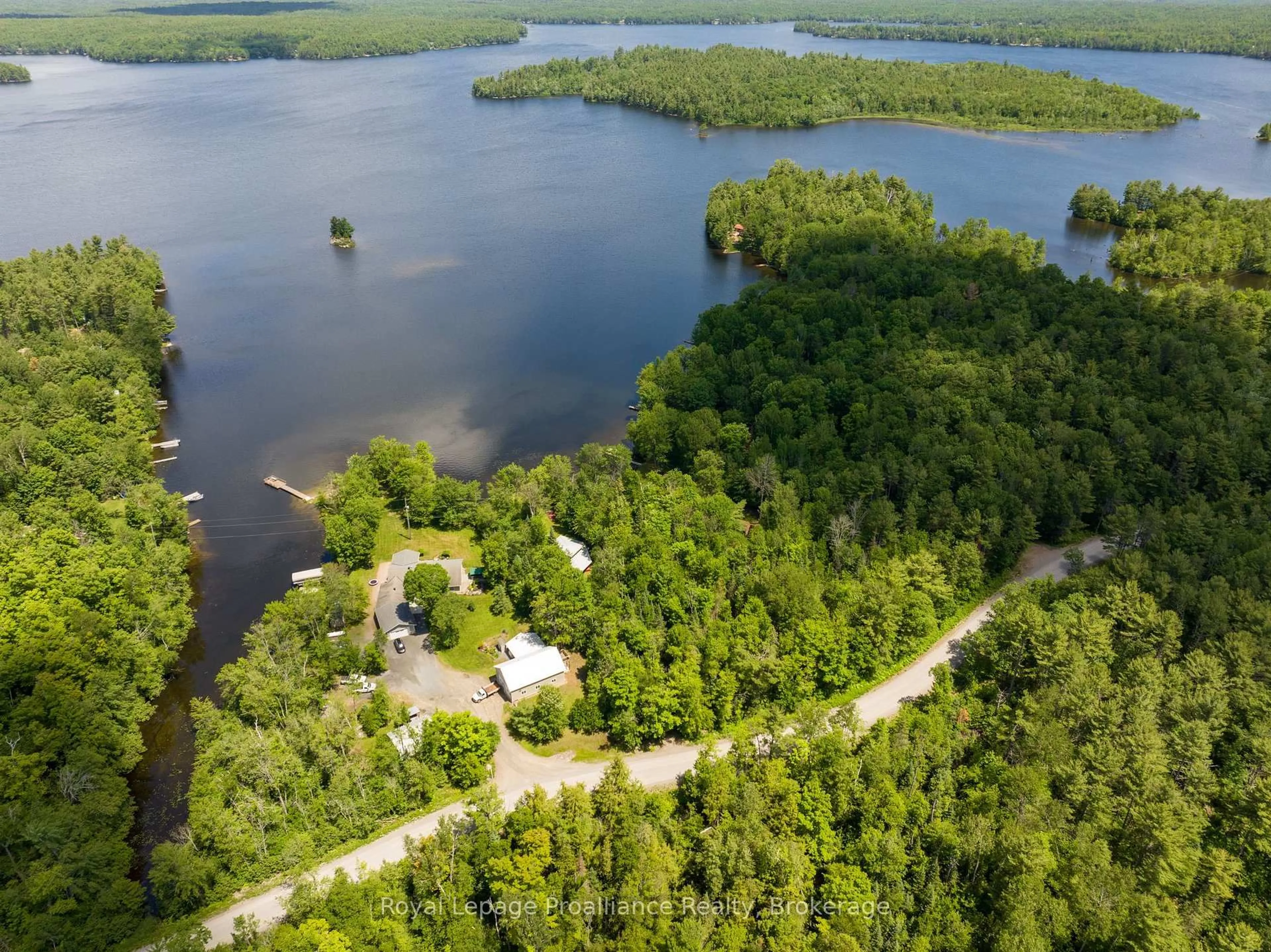 A pic from outside/outdoor area/front of a property/back of a property/a pic from drone, water/lake/river/ocean view for 1185 Hughes Landing Rd, Cloyne Ontario K0H 1K0