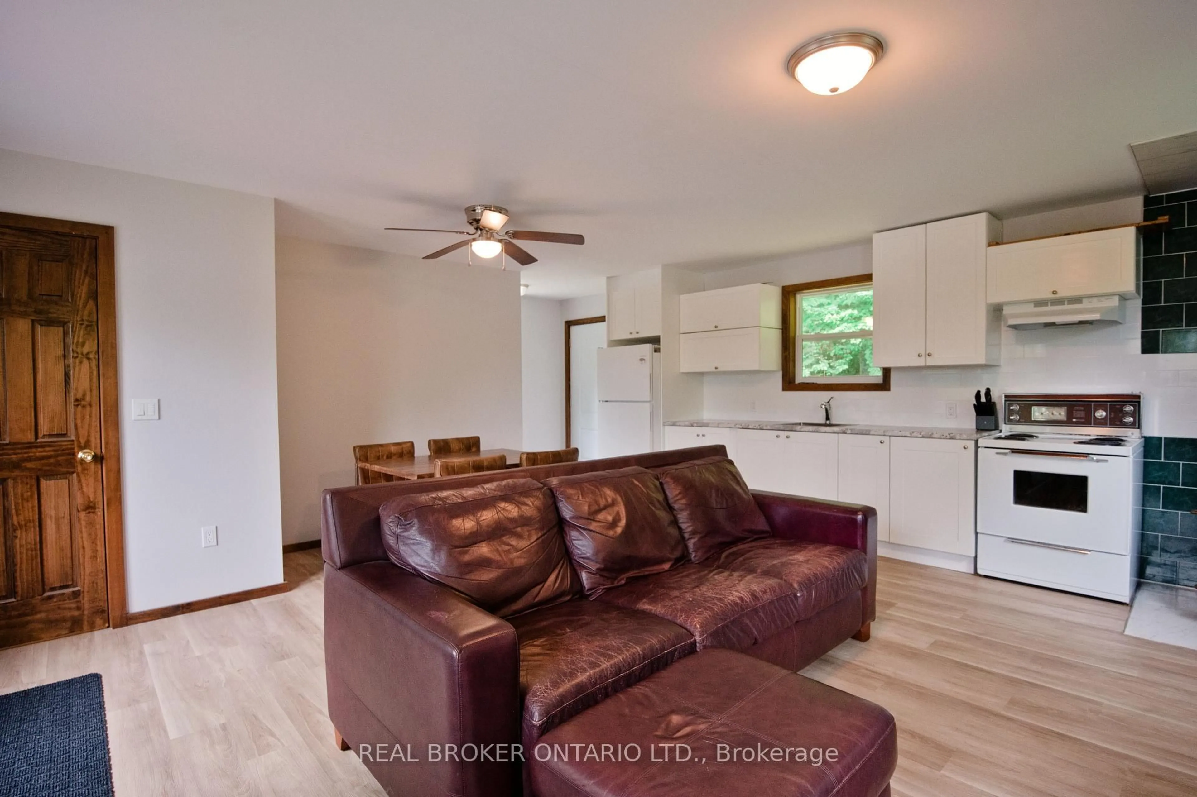 Living room with furniture, wood/laminate floor for 41 Andy Neville Pkwy, Machar Ontario P0A 1X0