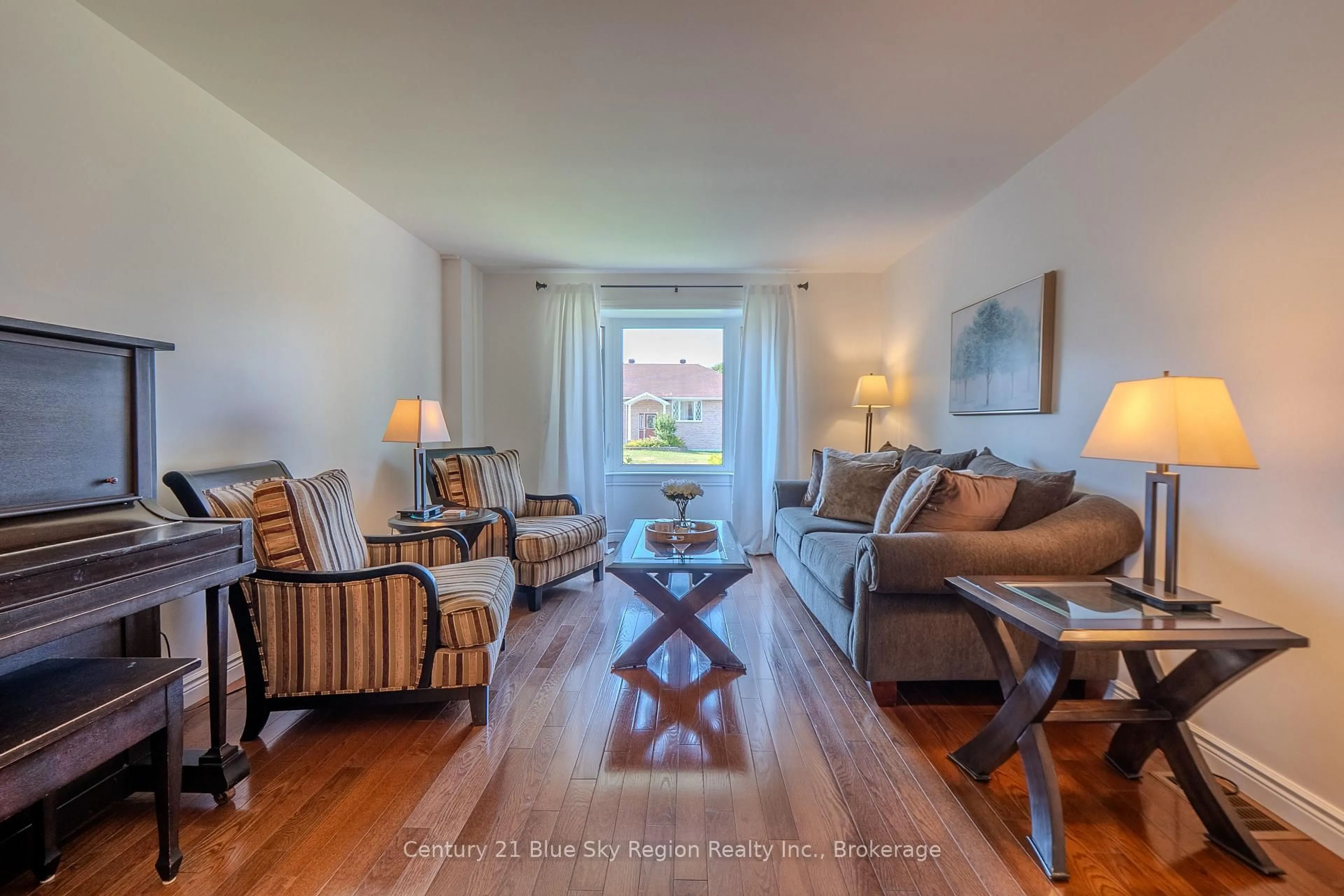 Living room with furniture, wood/laminate floor for 354 Elmwood Ave, North Bay Ontario P1B 9N4