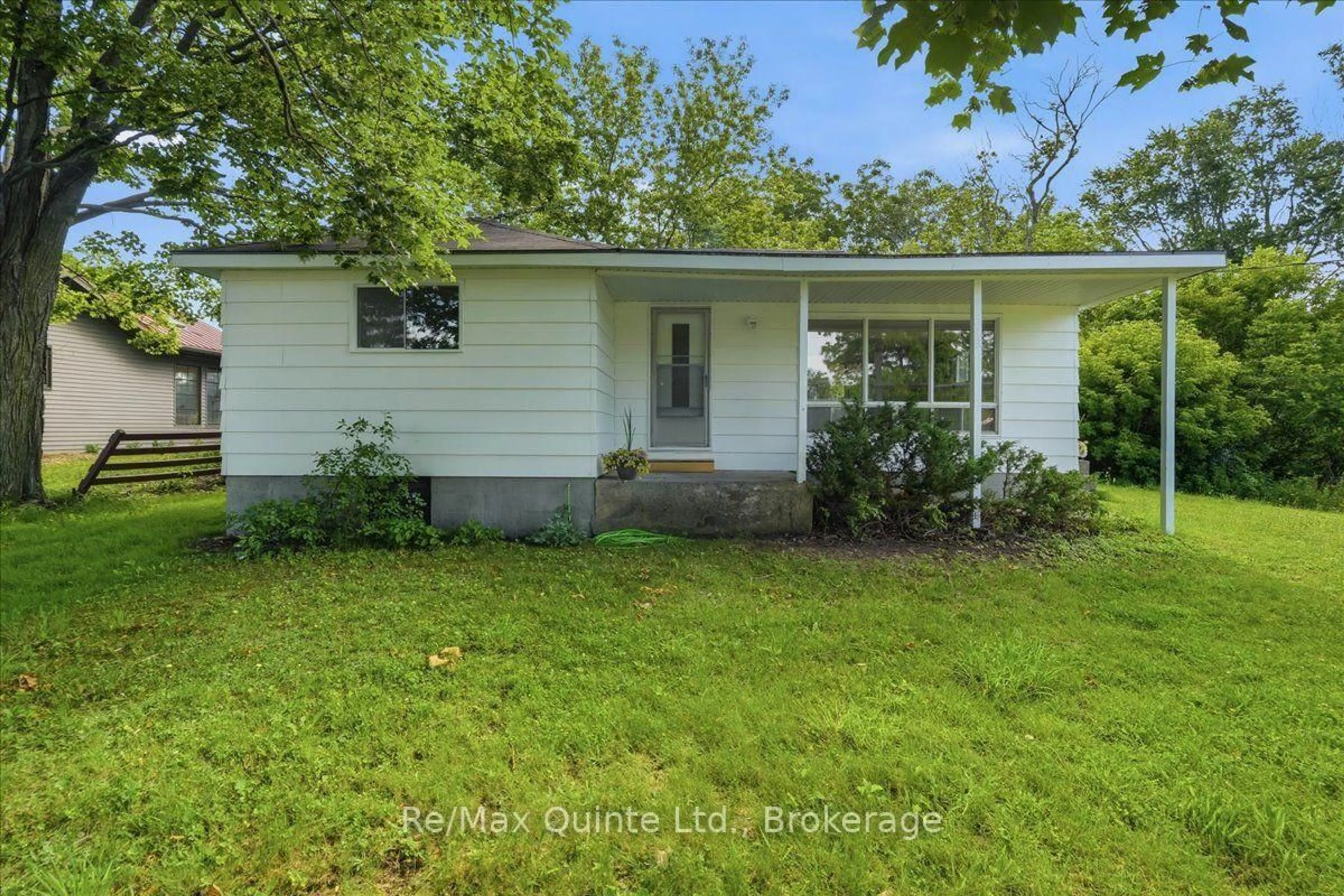Home with vinyl exterior material, street for 1581 County Rd 10, Prince Edward County Ontario K0K 1P0