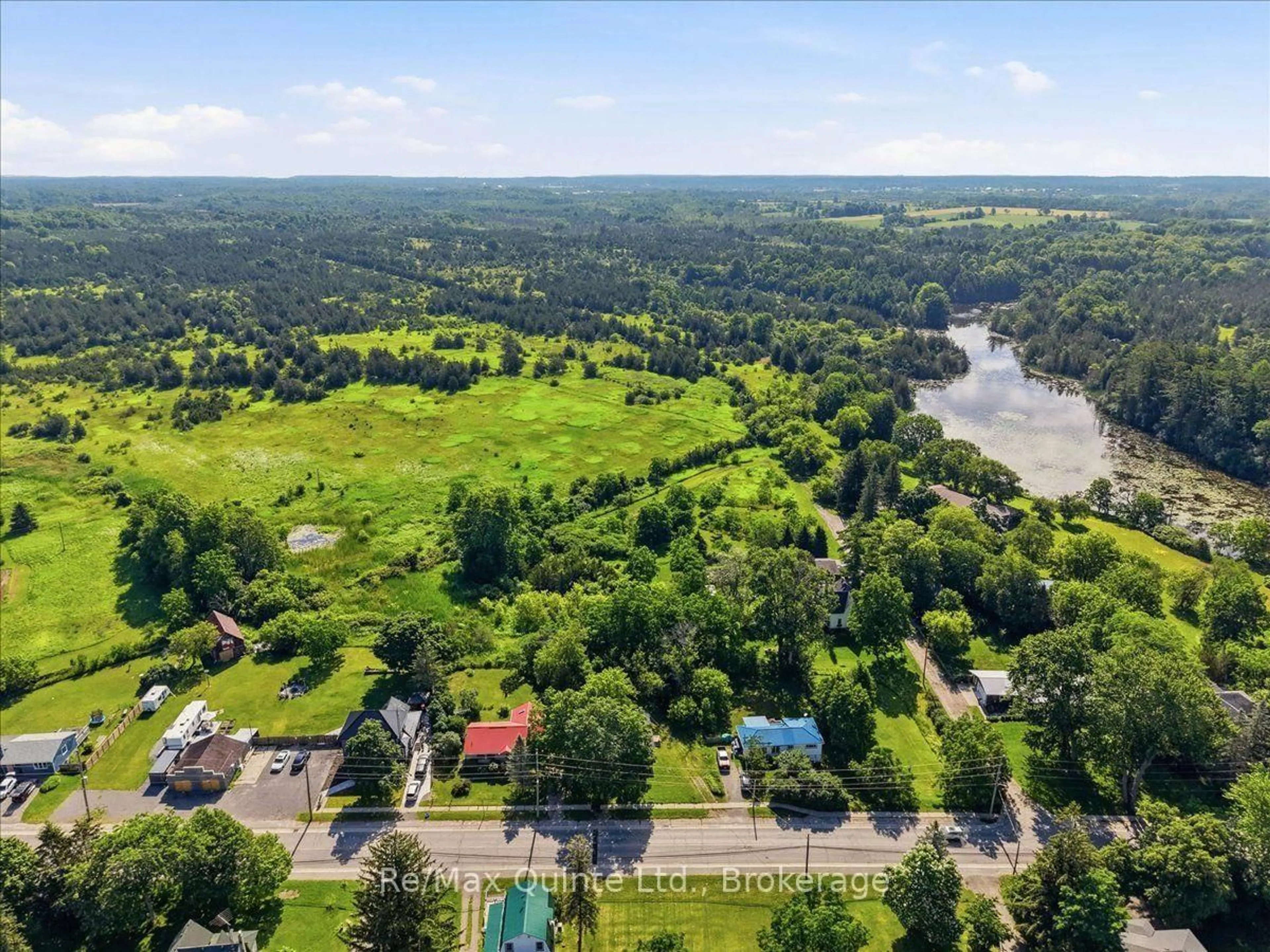 A pic from outside/outdoor area/front of a property/back of a property/a pic from drone, water/lake/river/ocean view for 1581 County Rd 10, Prince Edward County Ontario K0K 1P0