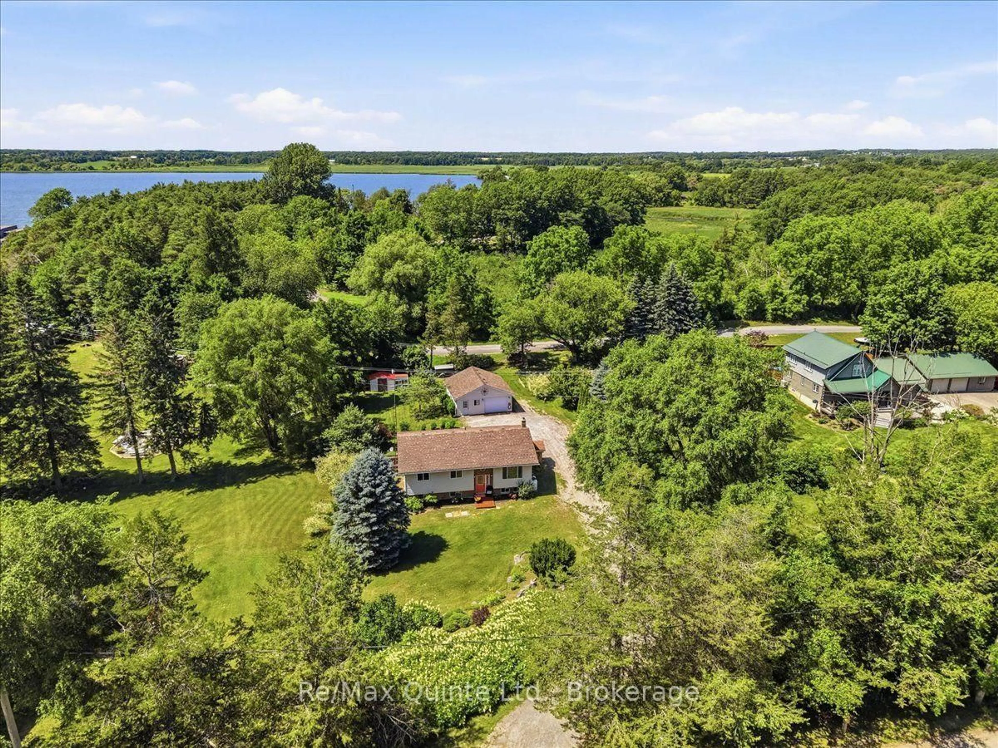 A pic from outside/outdoor area/front of a property/back of a property/a pic from drone, water/lake/river/ocean view for 50 County Road 18, Prince Edward County Ontario K0K 1P0