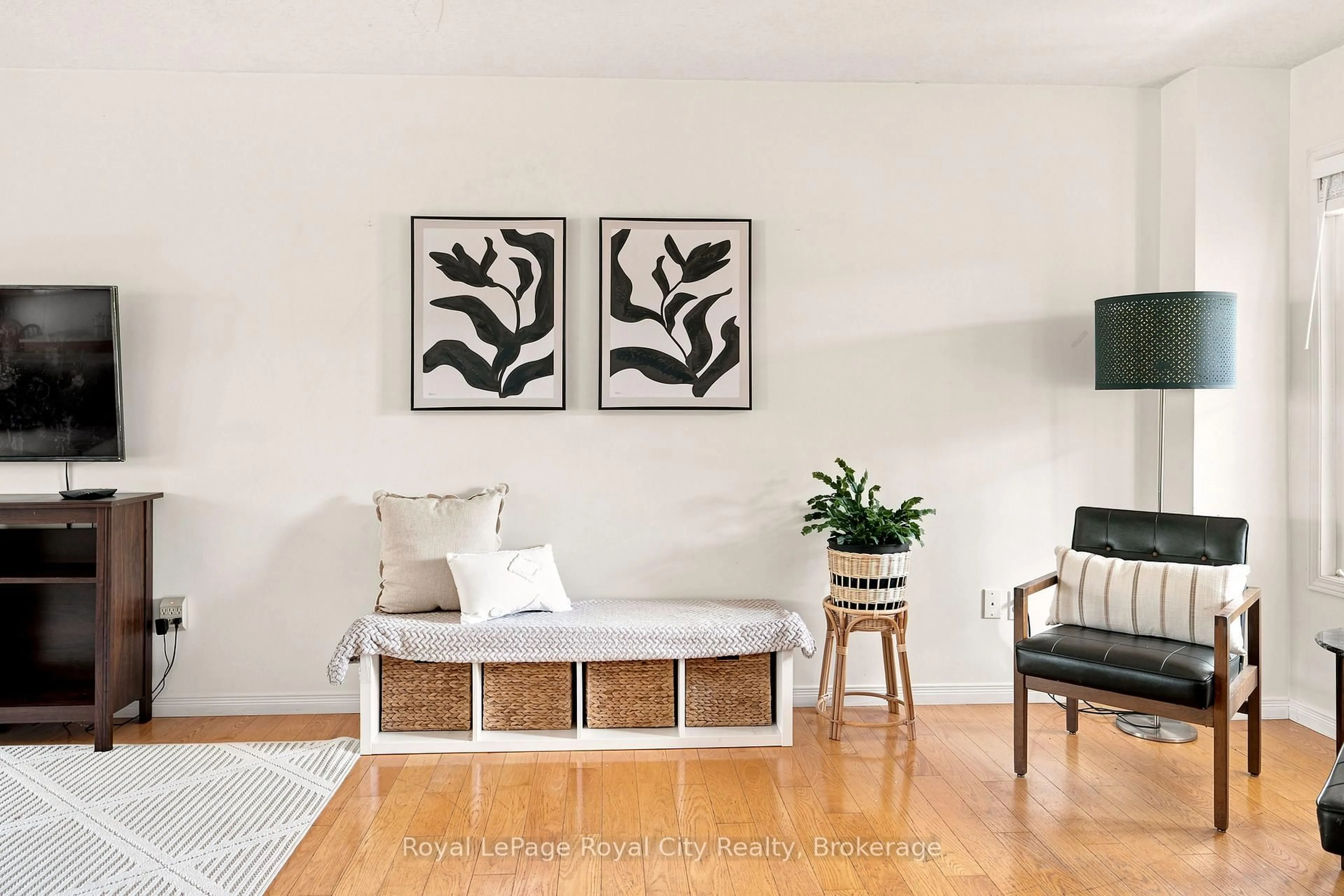 Living room with furniture, wood/laminate floor for 43 Fletcher Crt, Guelph Ontario N1E 7G8