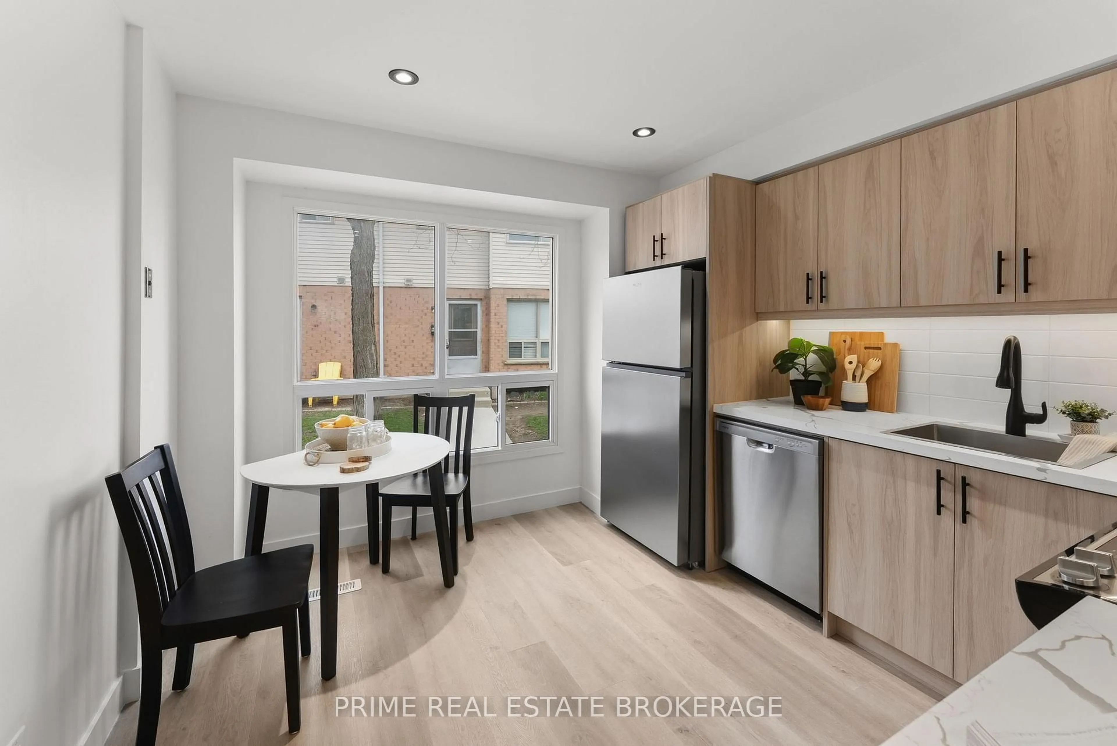 Open concept kitchen, wood/laminate floor for 126 Belmont Dr #48, London South Ontario N6J 4W1