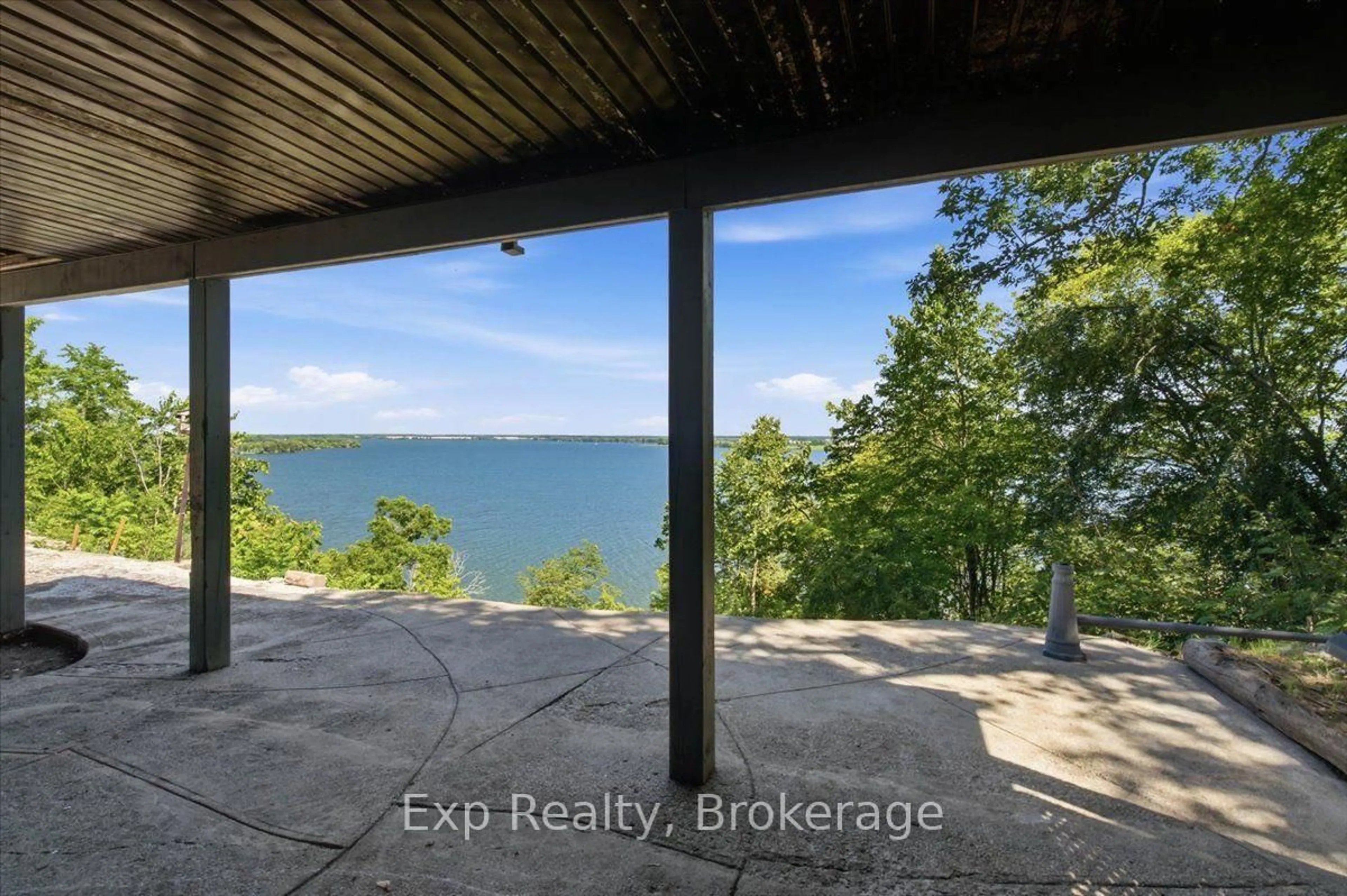 A pic from outside/outdoor area/front of a property/back of a property/a pic from drone, water/lake/river/ocean view for 23 Sidney Shore Lane, Prince Edward County Ontario K0K 2T0