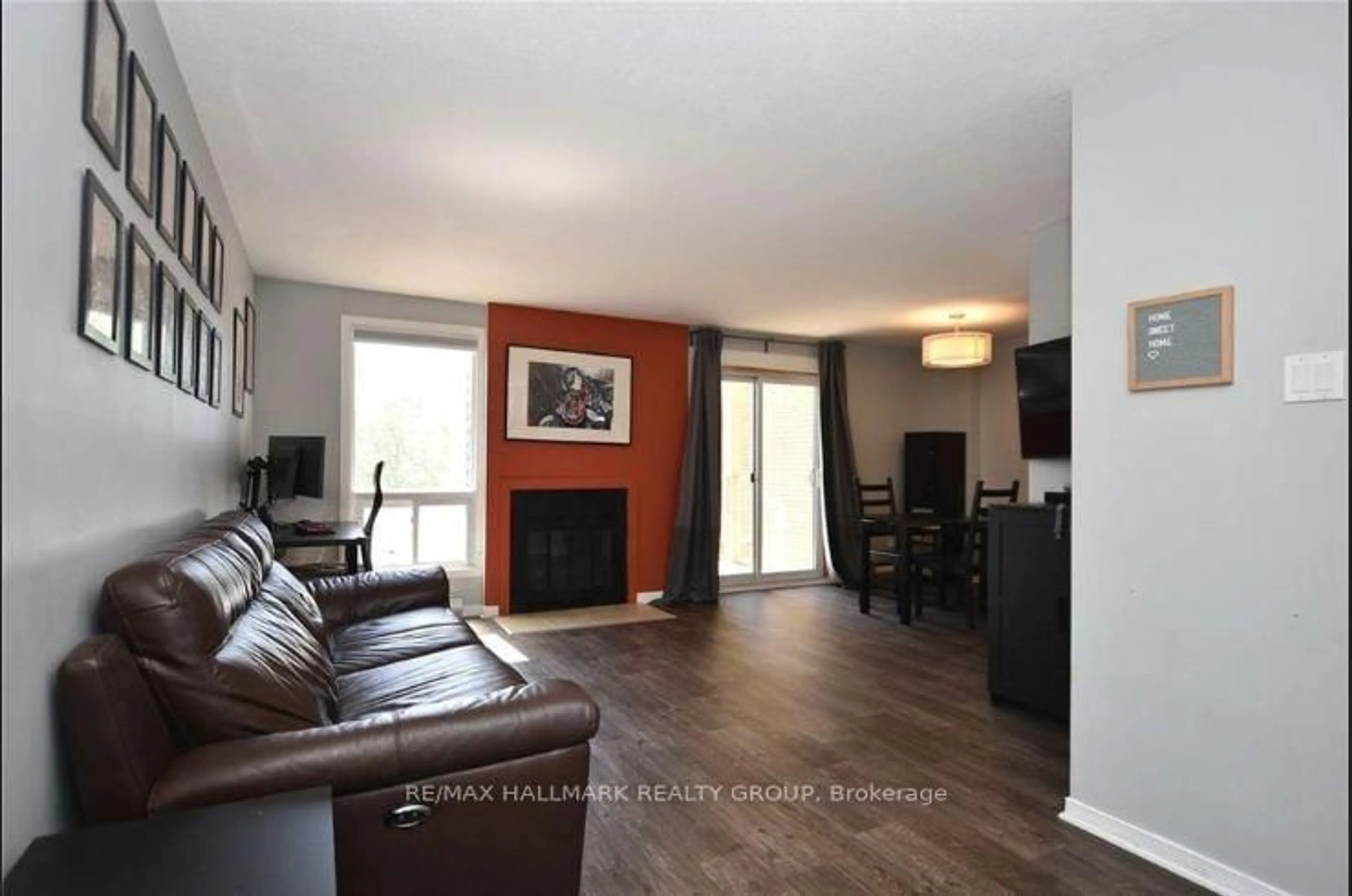 Living room with furniture, wood/laminate floor for 14 Sweetbriar Circ #1, Ottawa Ontario K2J 2K4