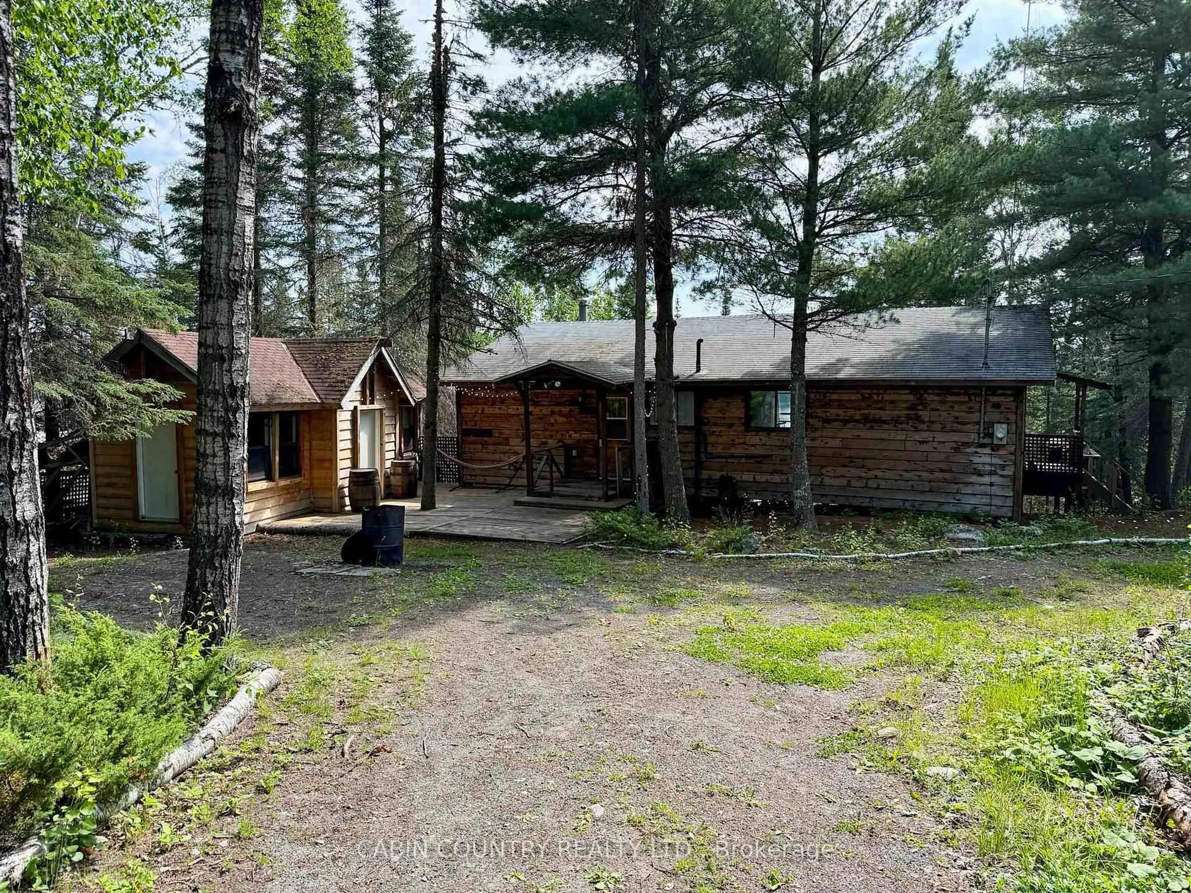 A pic from outside/outdoor area/front of a property/back of a property/a pic from drone, forest/trees view for 909 Austin Lake Road, Kenora Ontario P9N 4R2