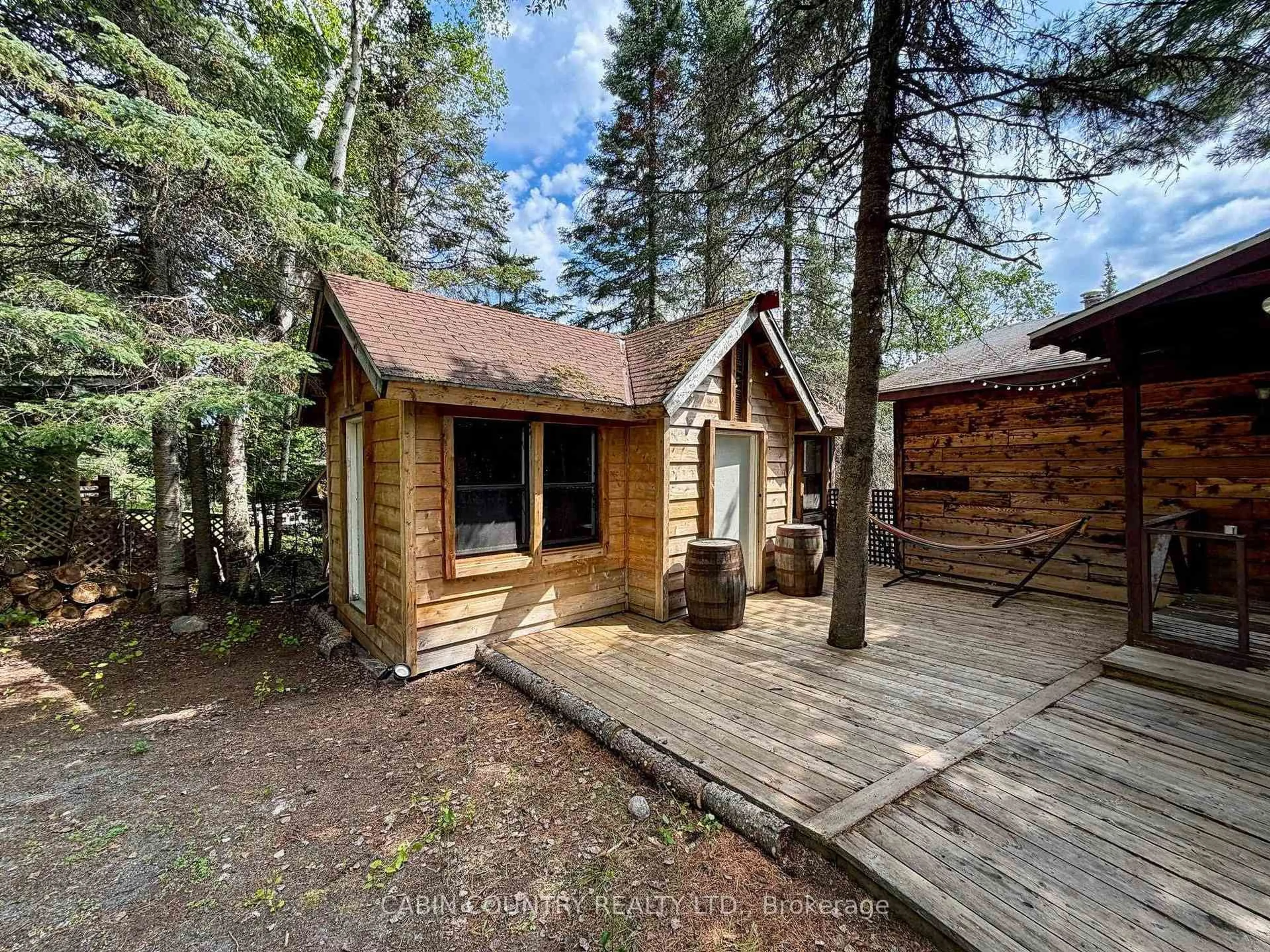 A pic from outside/outdoor area/front of a property/back of a property/a pic from drone, forest/trees view for 909 Austin Lake Road, Kenora Ontario P9N 4R2