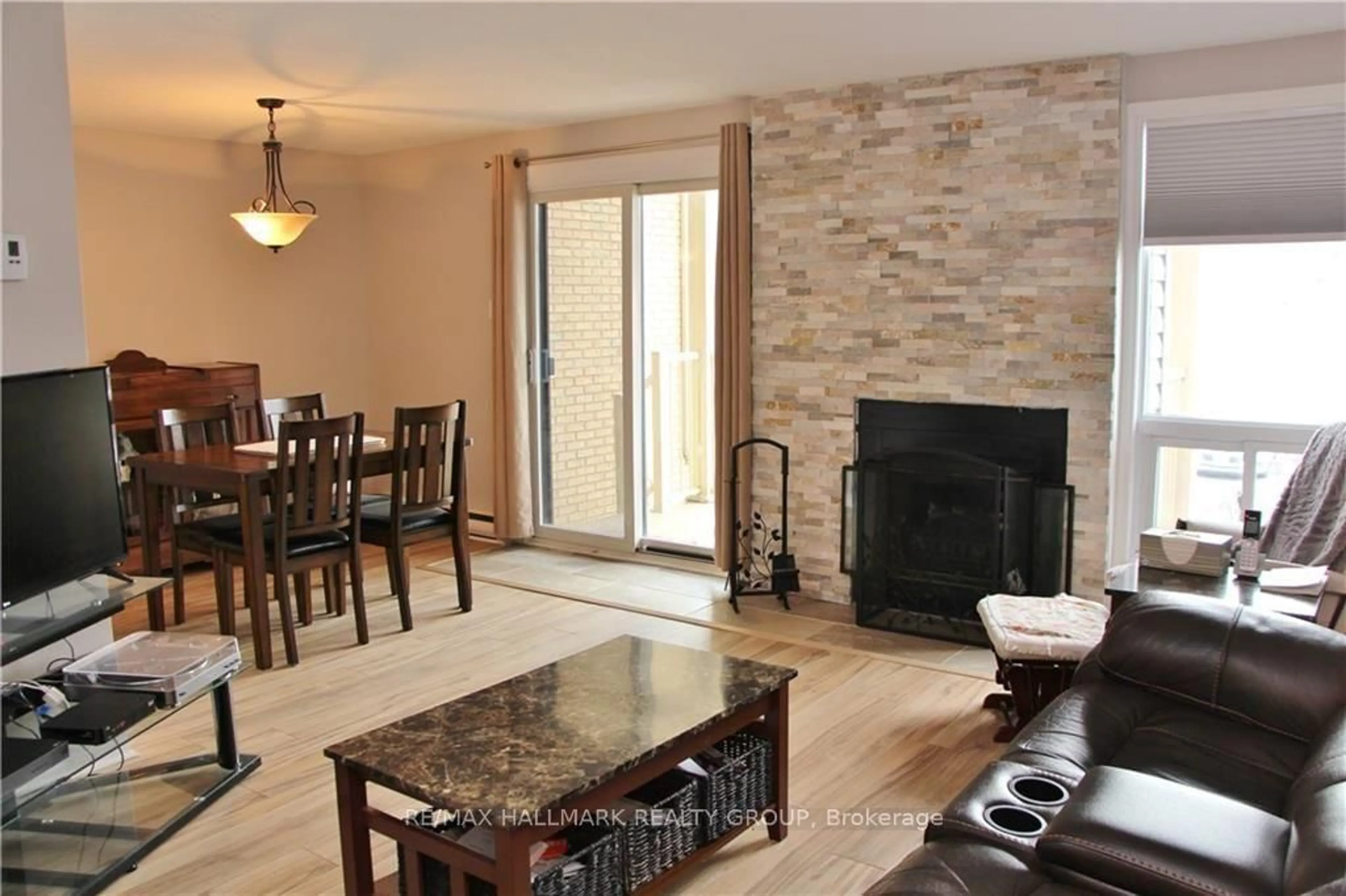 Living room with furniture, wood/laminate floor for 14 Sweetbriar Circ #4, Ottawa Ontario K2J 2K4