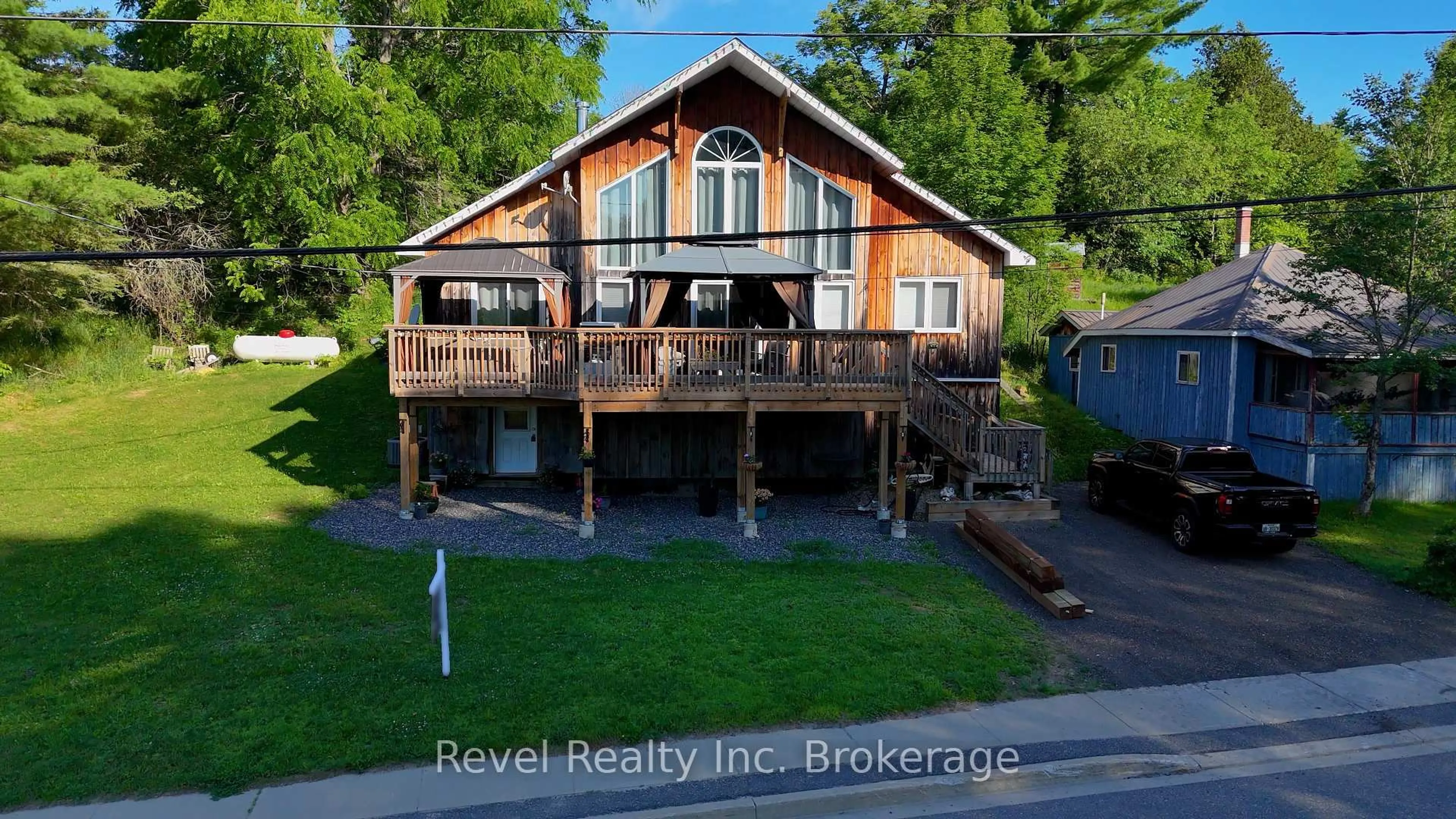 A pic from outside/outdoor area/front of a property/back of a property/a pic from drone, water/lake/river/ocean view for 2242 Highway 124, Whitestone Ontario P0A 1G0
