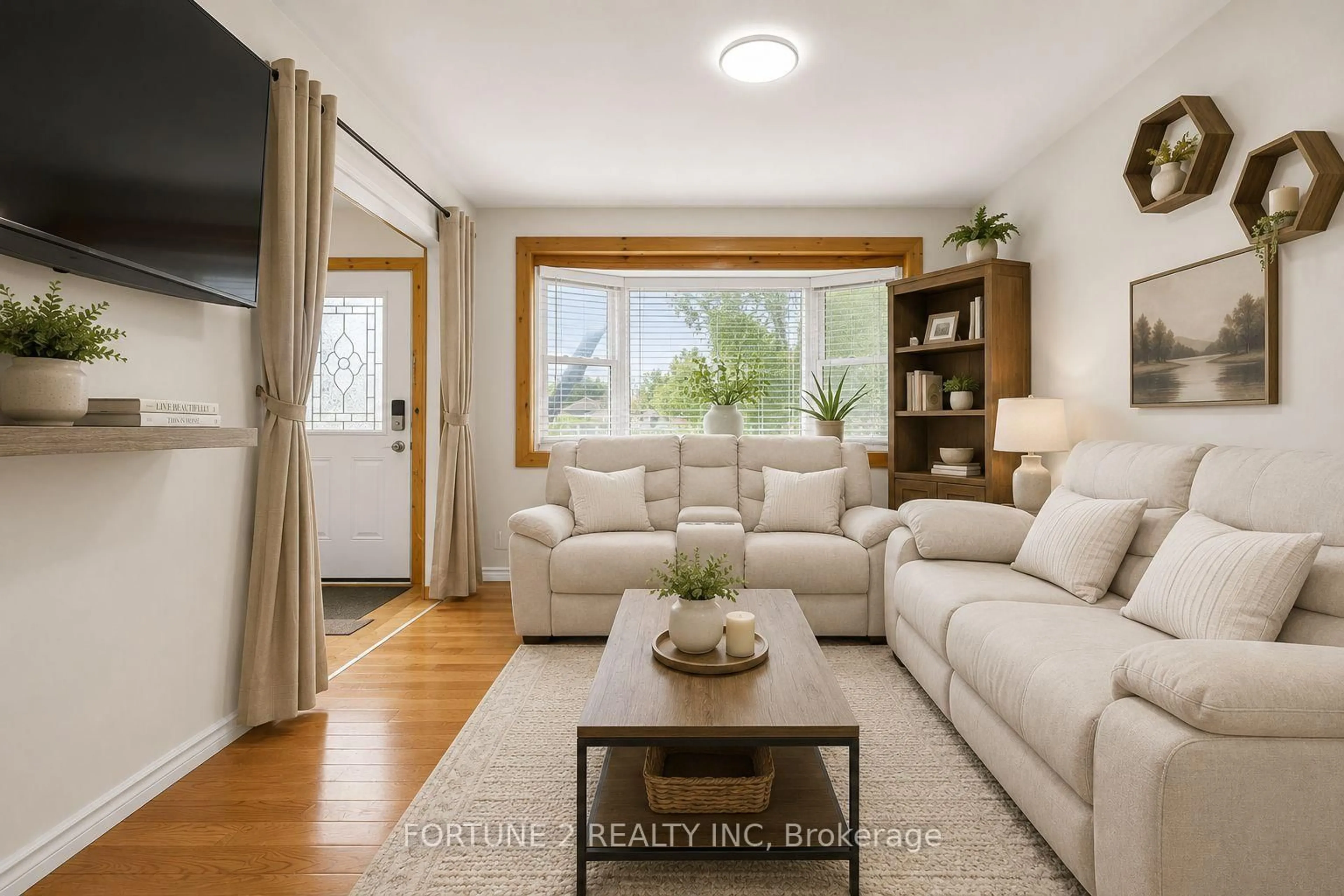 Living room with furniture, wood/laminate floor for 570 Pall Mall St, London East Ontario N5Y 2Z7