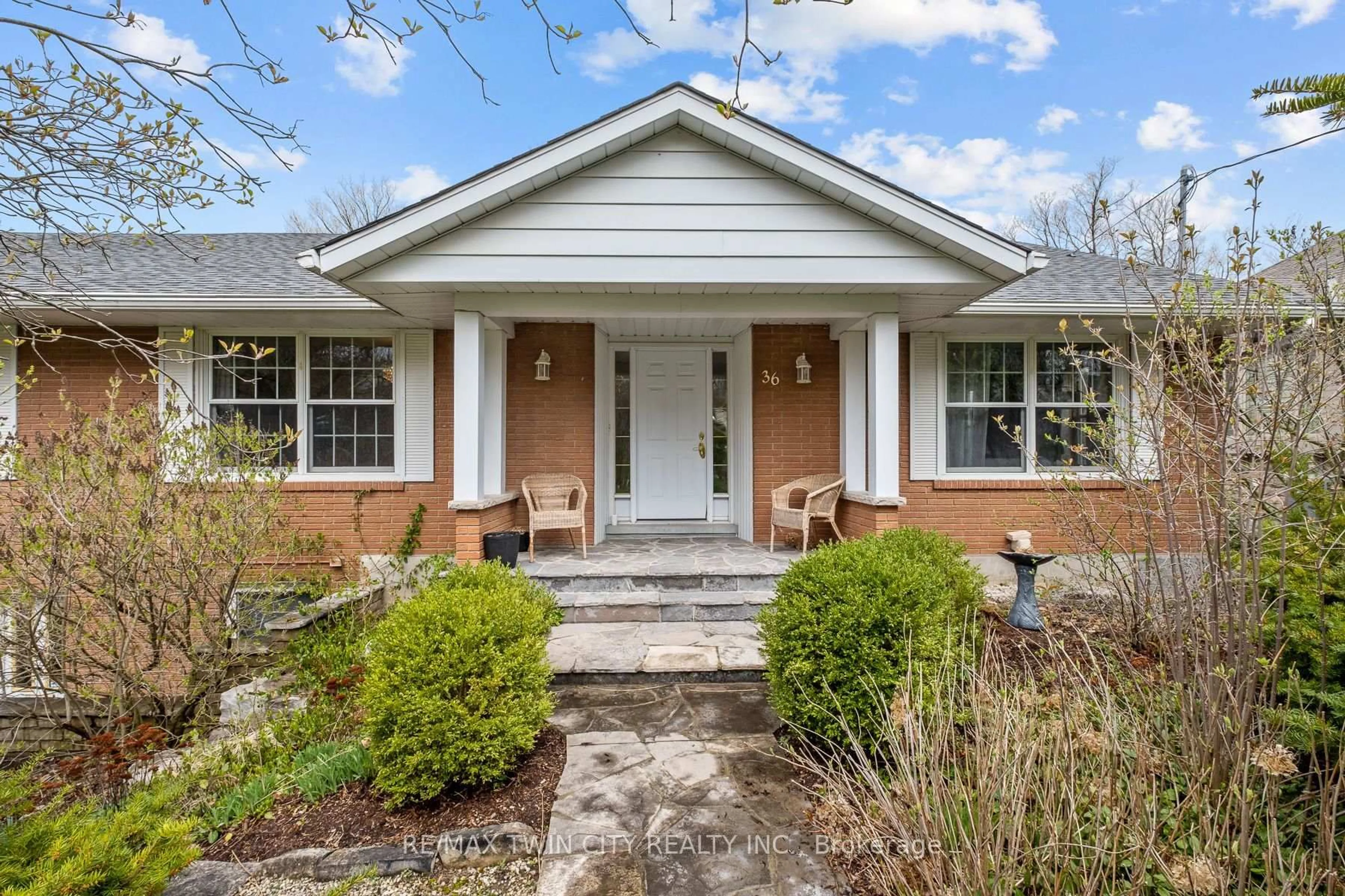 Home with brick exterior material, street for 36 Maple Hill Dr, Kitchener Ontario N2M 2R8
