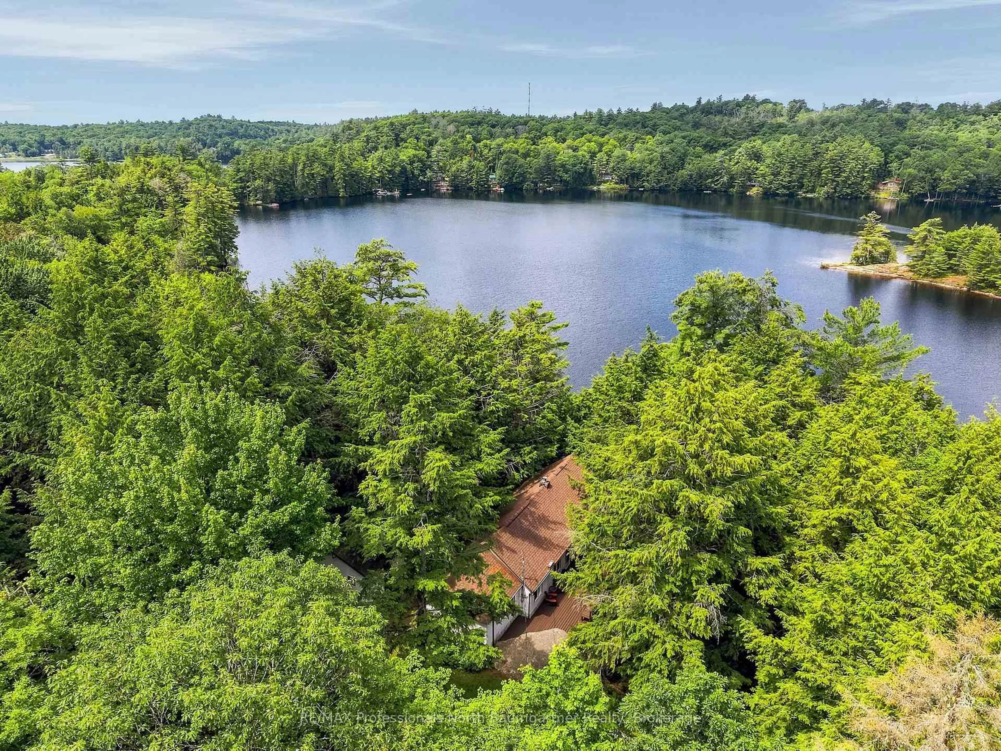 A pic from outside/outdoor area/front of a property/back of a property/a pic from drone, water/lake/river/ocean view for 1202 Three Brothers Dr, Algonquin Highlands Ontario K0M 1S0