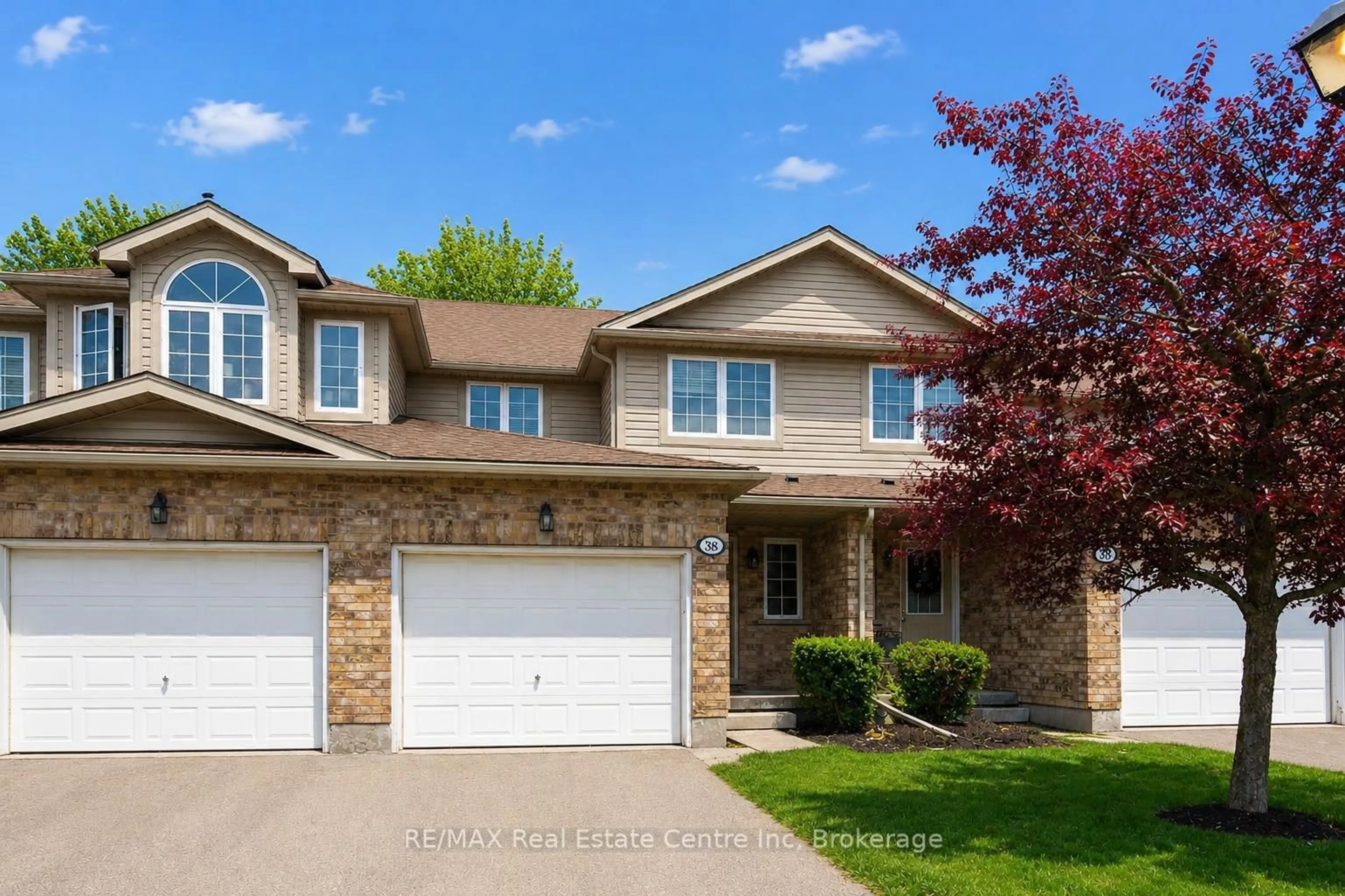 Home with brick exterior material, street for 210 DAWN Ave #38, Guelph Ontario N1G 5L5