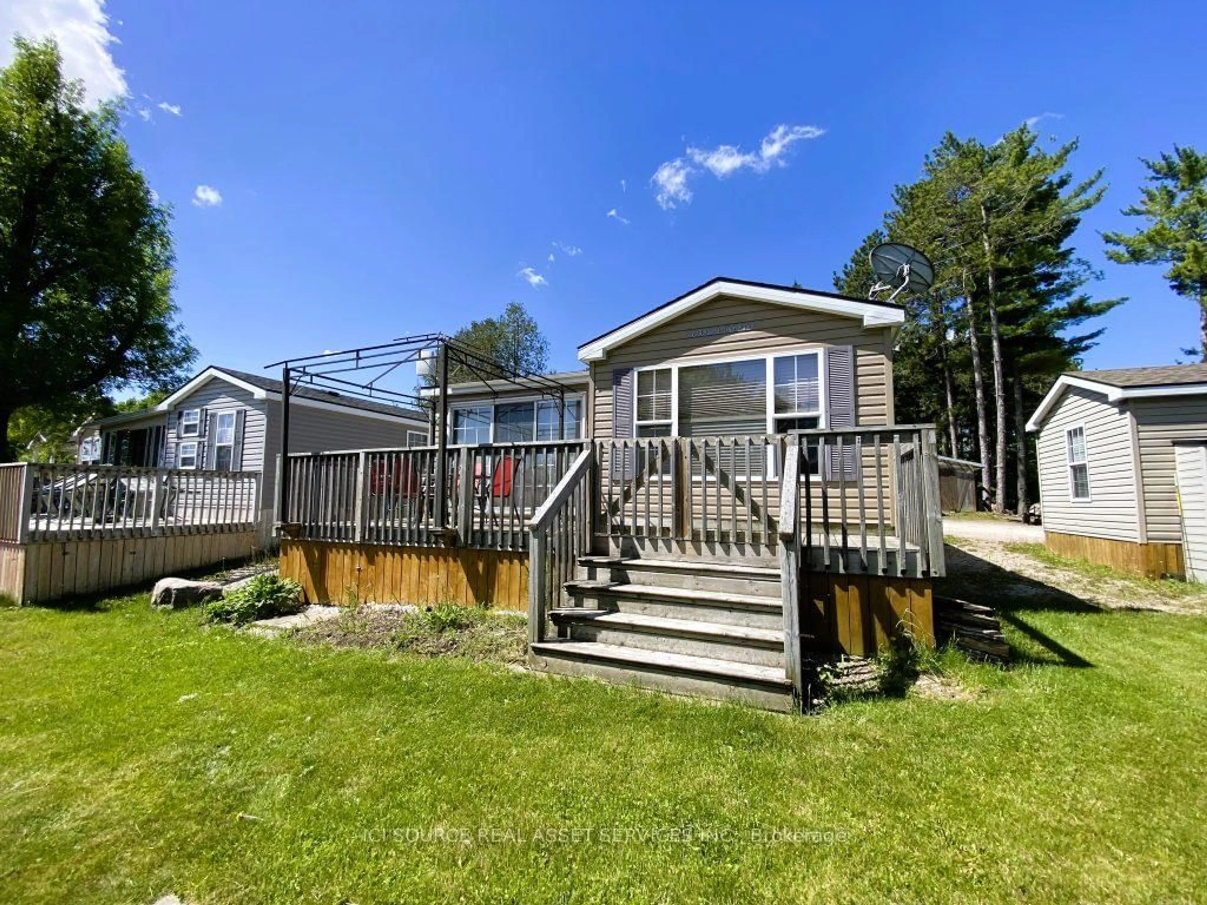 A pic from outside/outdoor area/front of a property/back of a property/a pic from drone, water/lake/river/ocean view for 155 McCrearys Beach #FHR506, Perth Ontario K7H 3C8