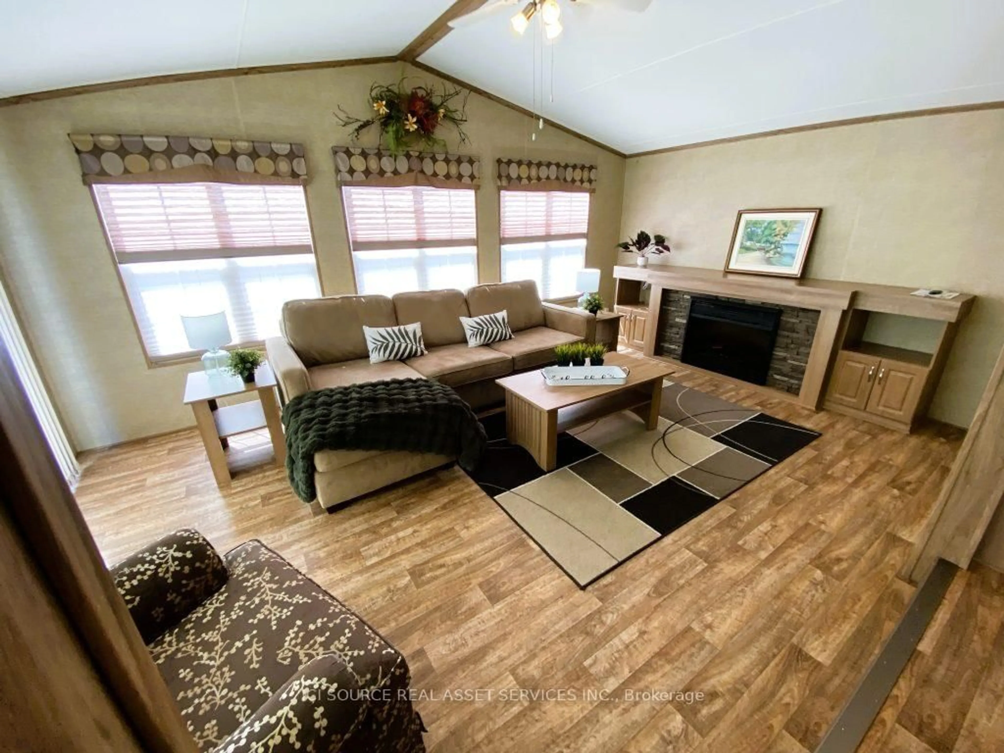 Living room with furniture, wood/laminate floor for 155 McCrearys Beach #FHR506, Perth Ontario K7H 3C8
