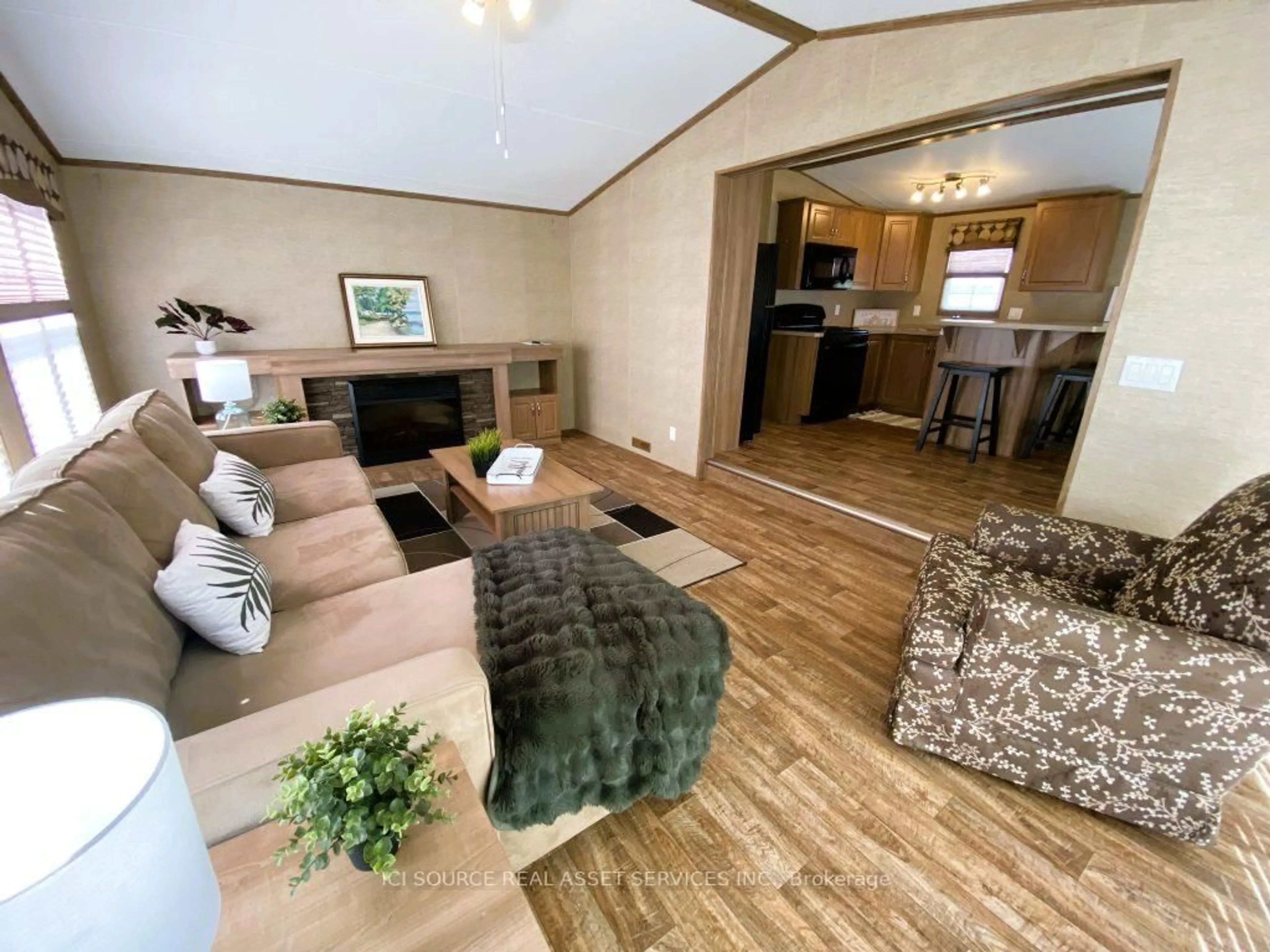 Living room with furniture, wood/laminate floor for 155 McCrearys Beach #FHR506, Perth Ontario K7H 3C8