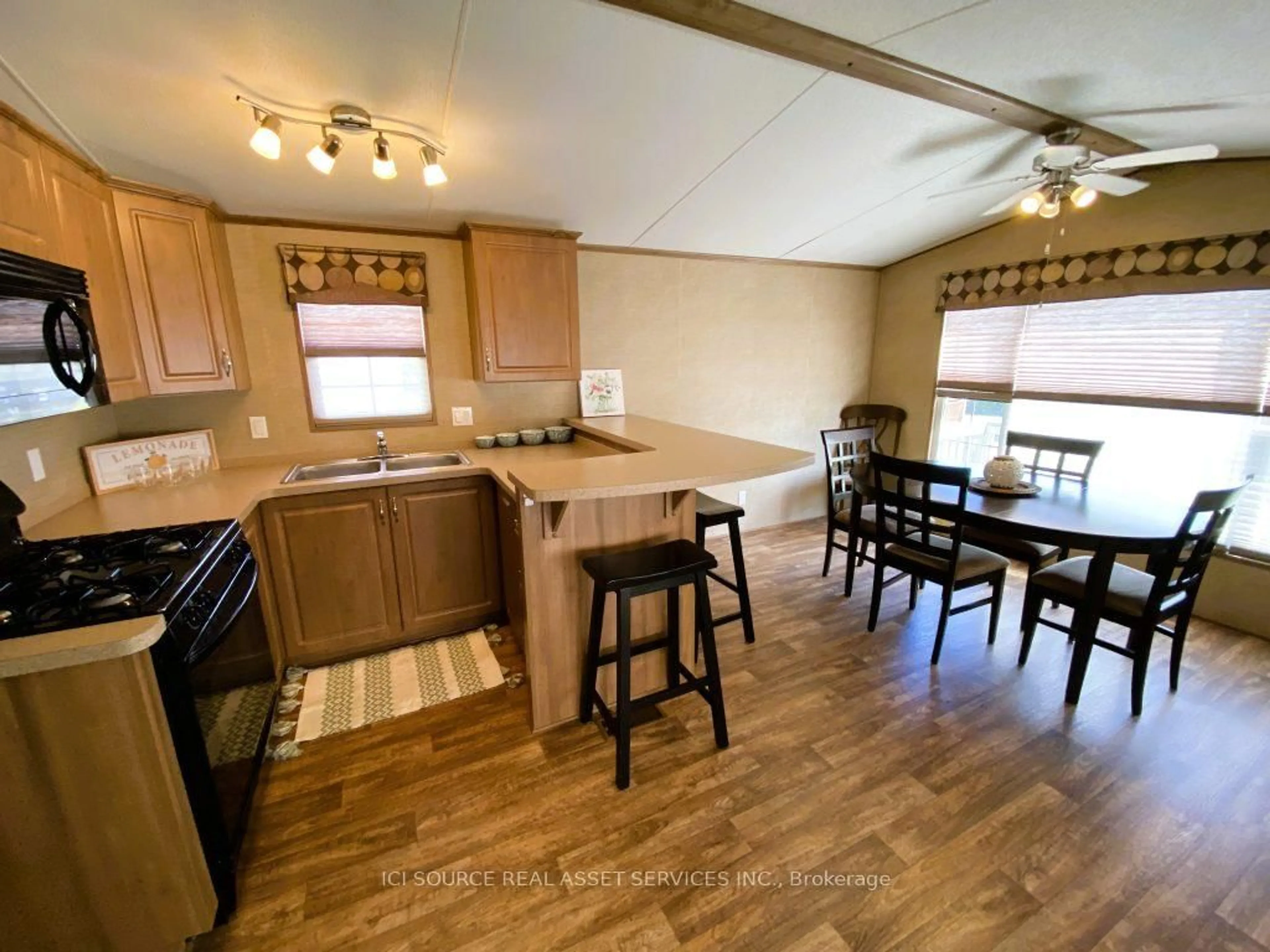 Open concept kitchen, wood/laminate floor for 155 McCrearys Beach #FHR506, Perth Ontario K7H 3C8
