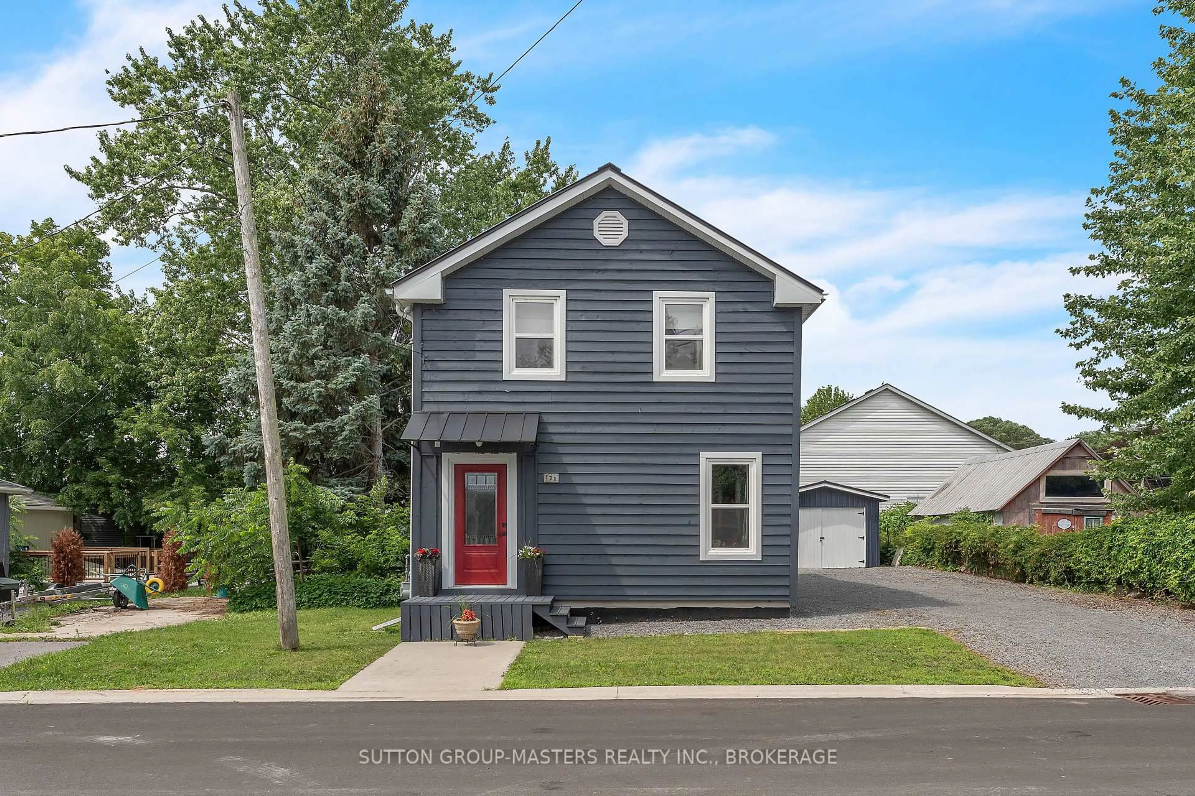 Home with vinyl exterior material, street for 173 Davy St, Bath Ontario K0H 1G0