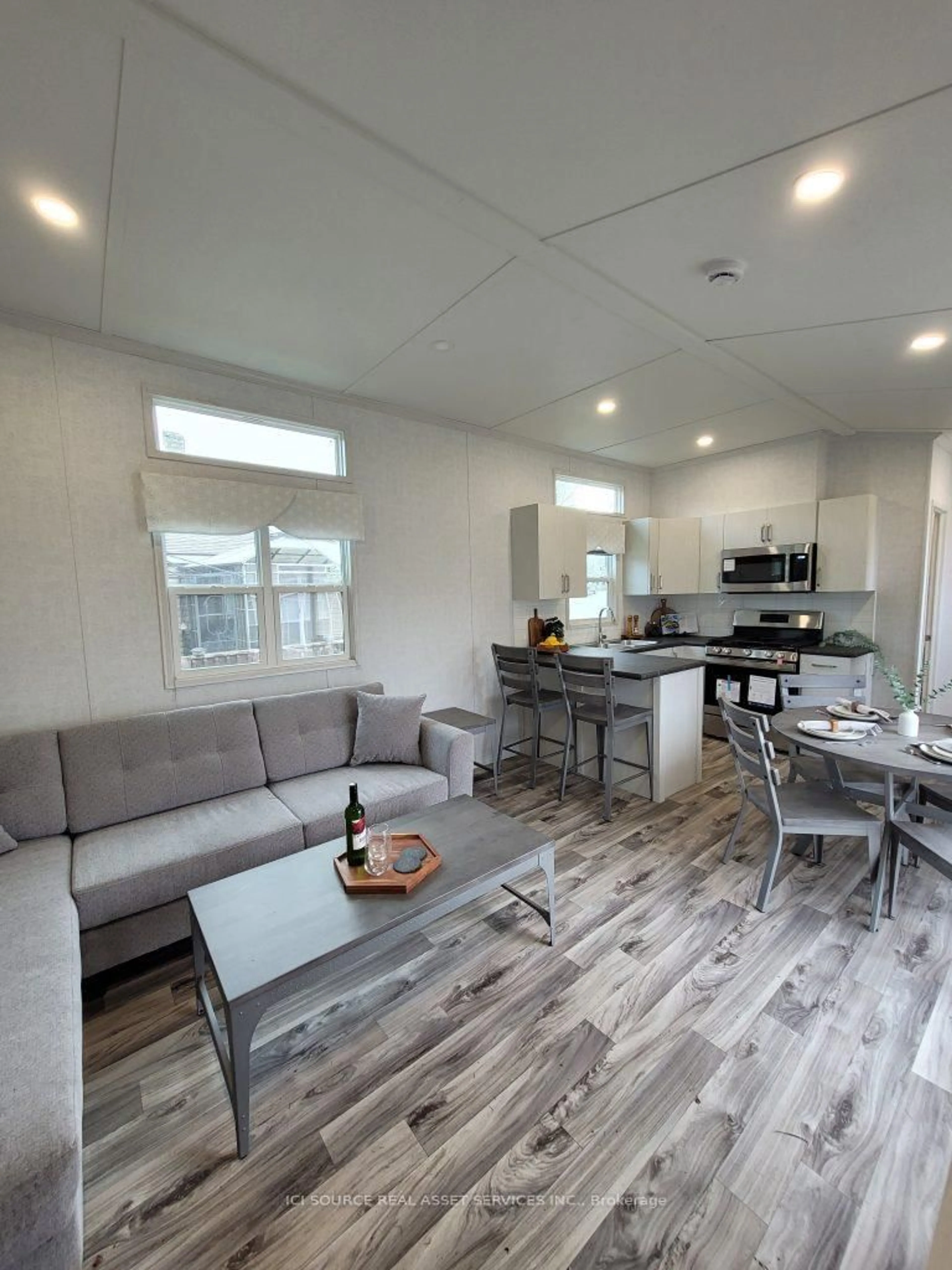 Open concept kitchen, wood/laminate floor for 171 Woodland Estates Rd #BBD030, Trent Hills Ontario K0L 1L0