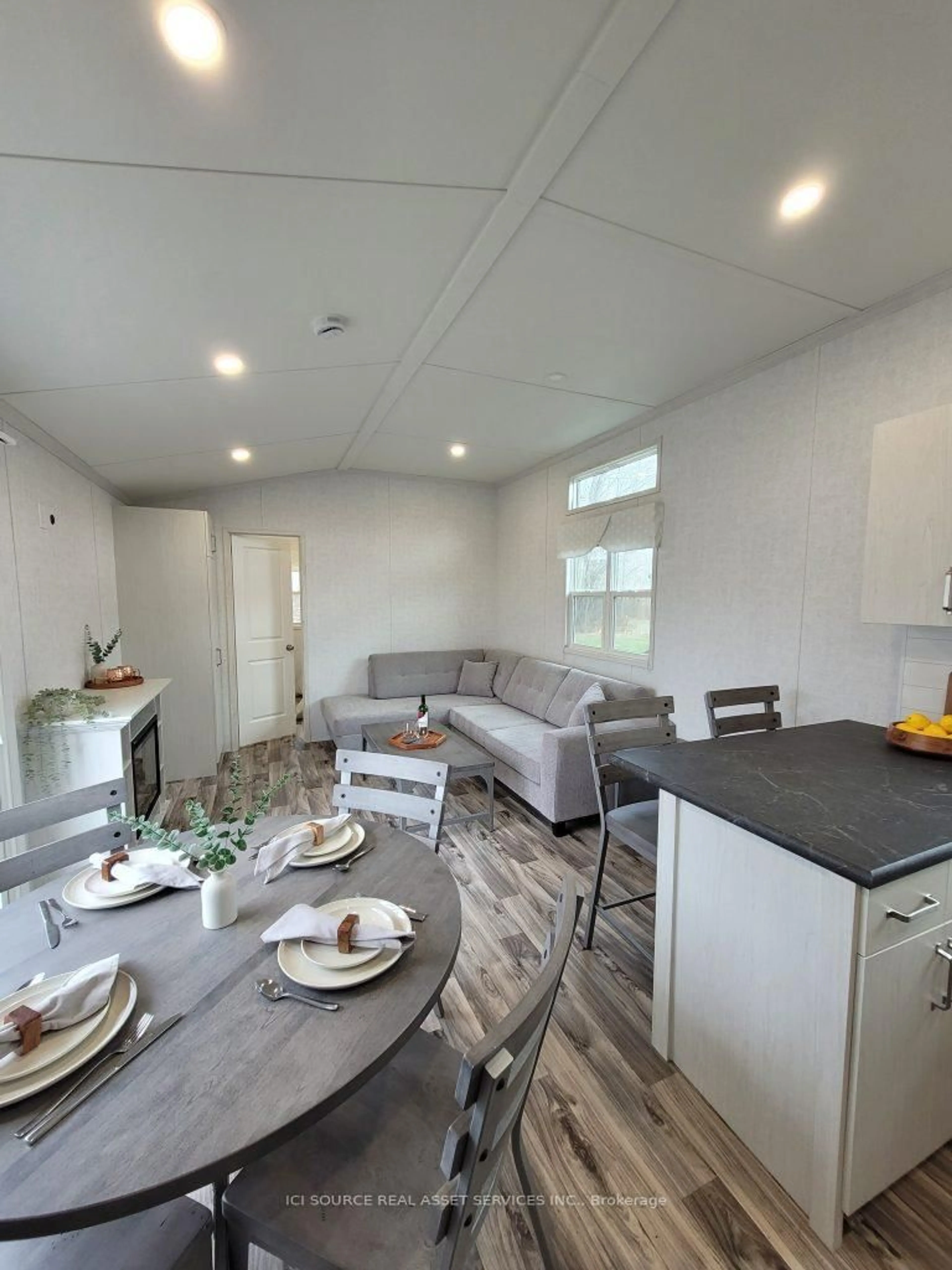 Open concept kitchen, wood/laminate floor for 171 Woodland Estates Rd #BBD030, Trent Hills Ontario K0L 1L0