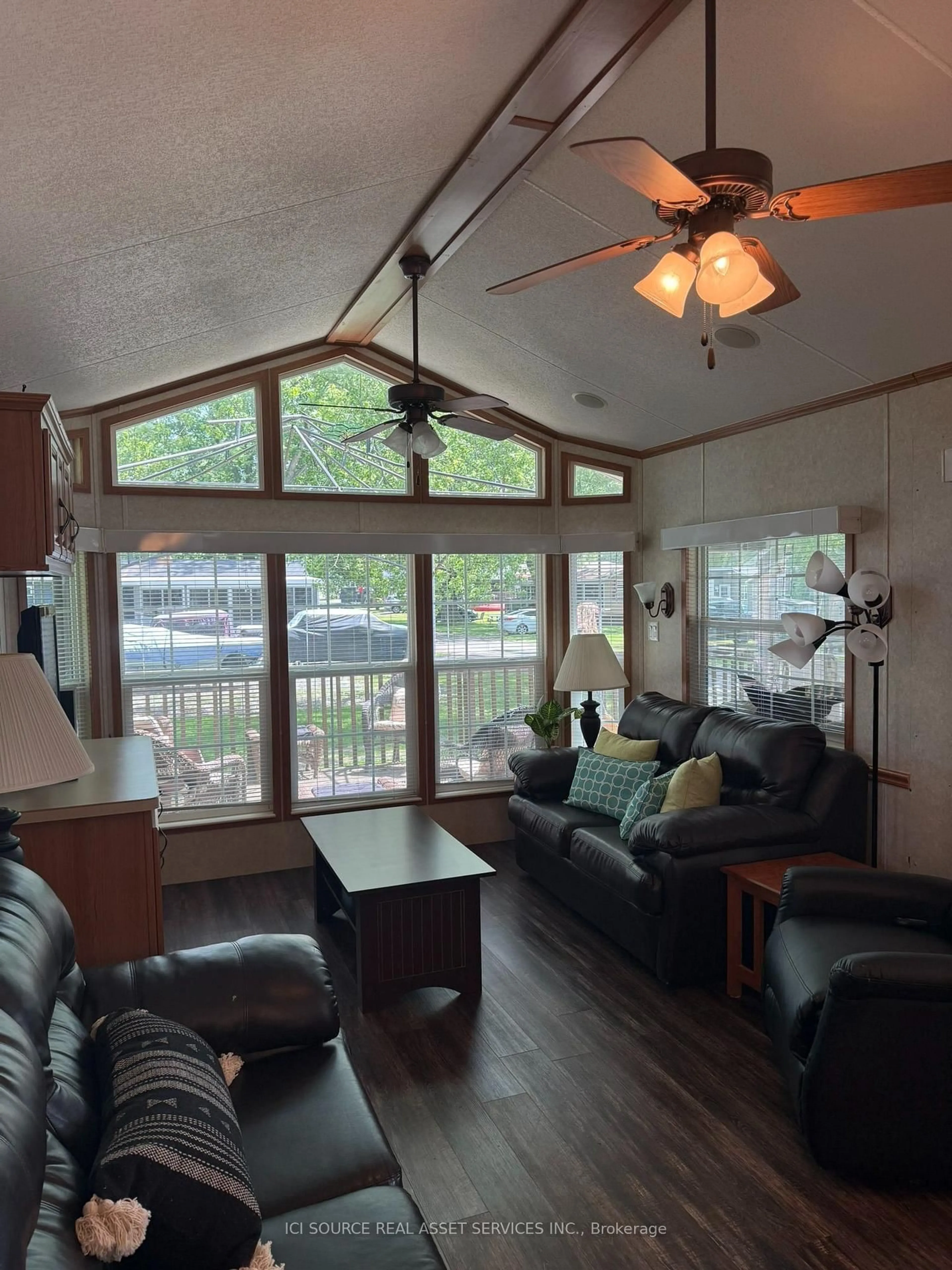 Living room with furniture, wood/laminate floor for 486 County Road 18 #CBL20, Prince Edward County Ontario K0K 1P0