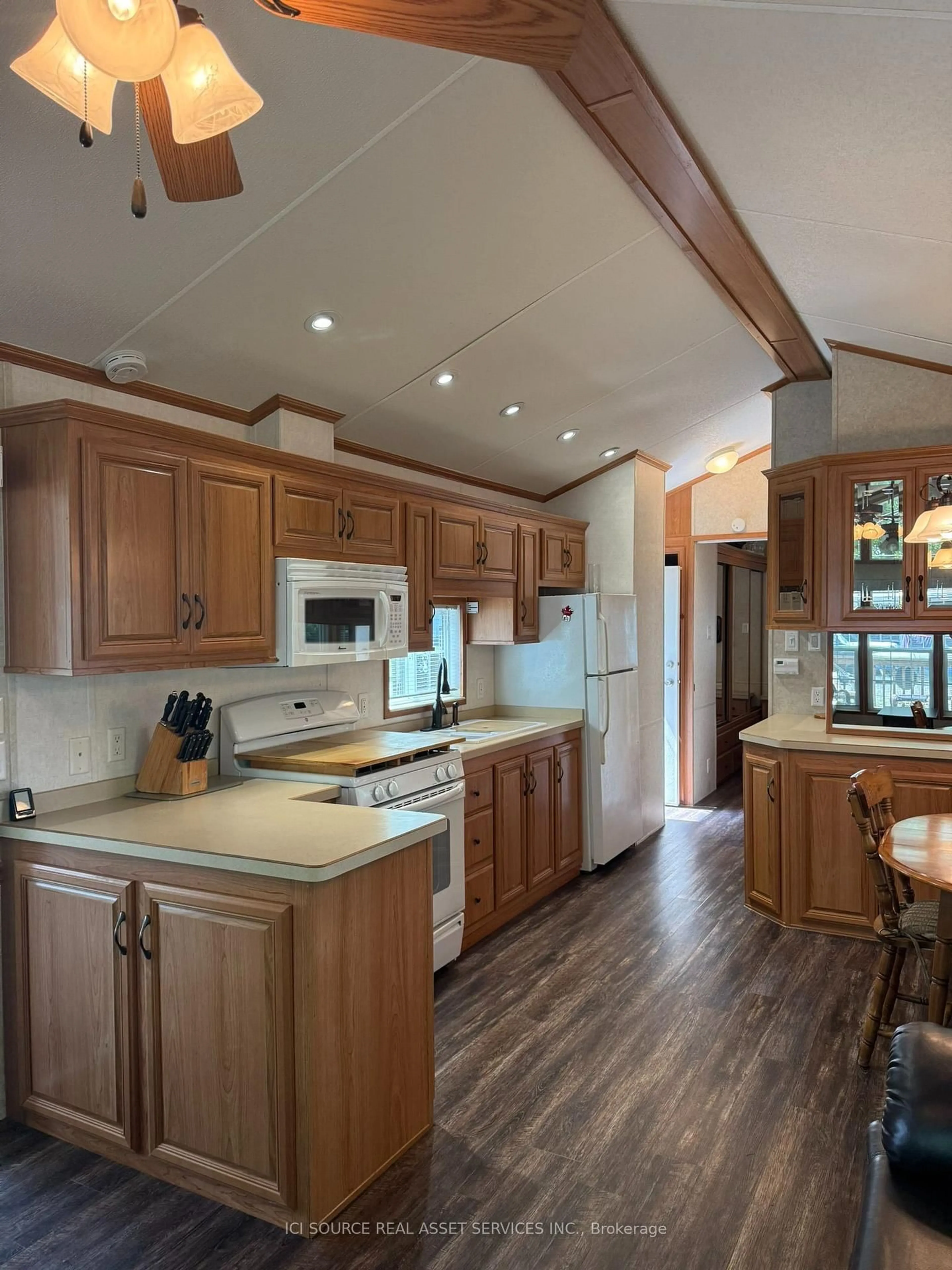 Open concept kitchen, wood/laminate floor for 486 County Road 18 #CBL20, Prince Edward County Ontario K0K 1P0