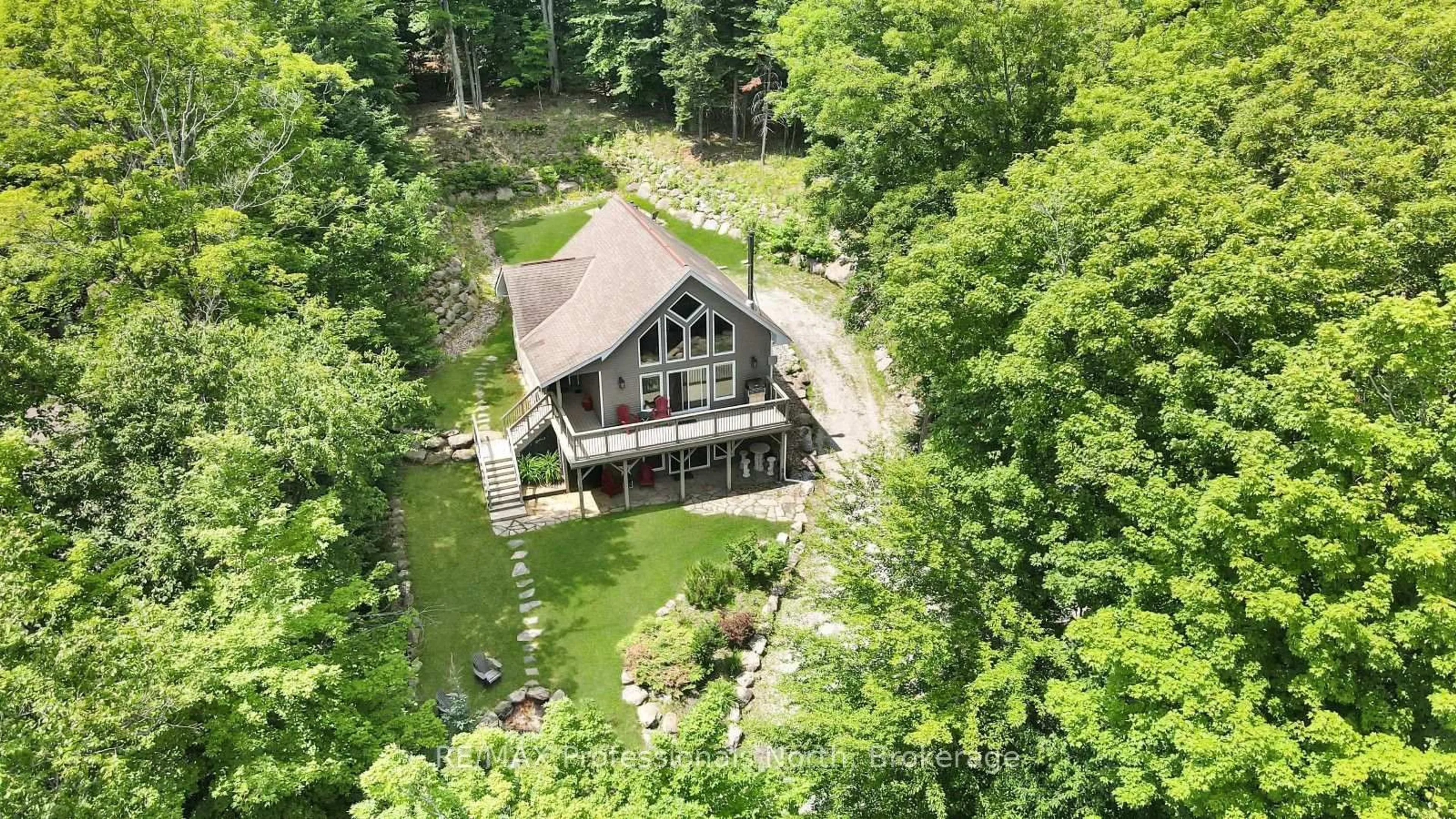 A pic from outside/outdoor area/front of a property/back of a property/a pic from drone, water/lake/river/ocean view for 1311 Wonderland Rd, Dysart et al Ontario K0M 1S0