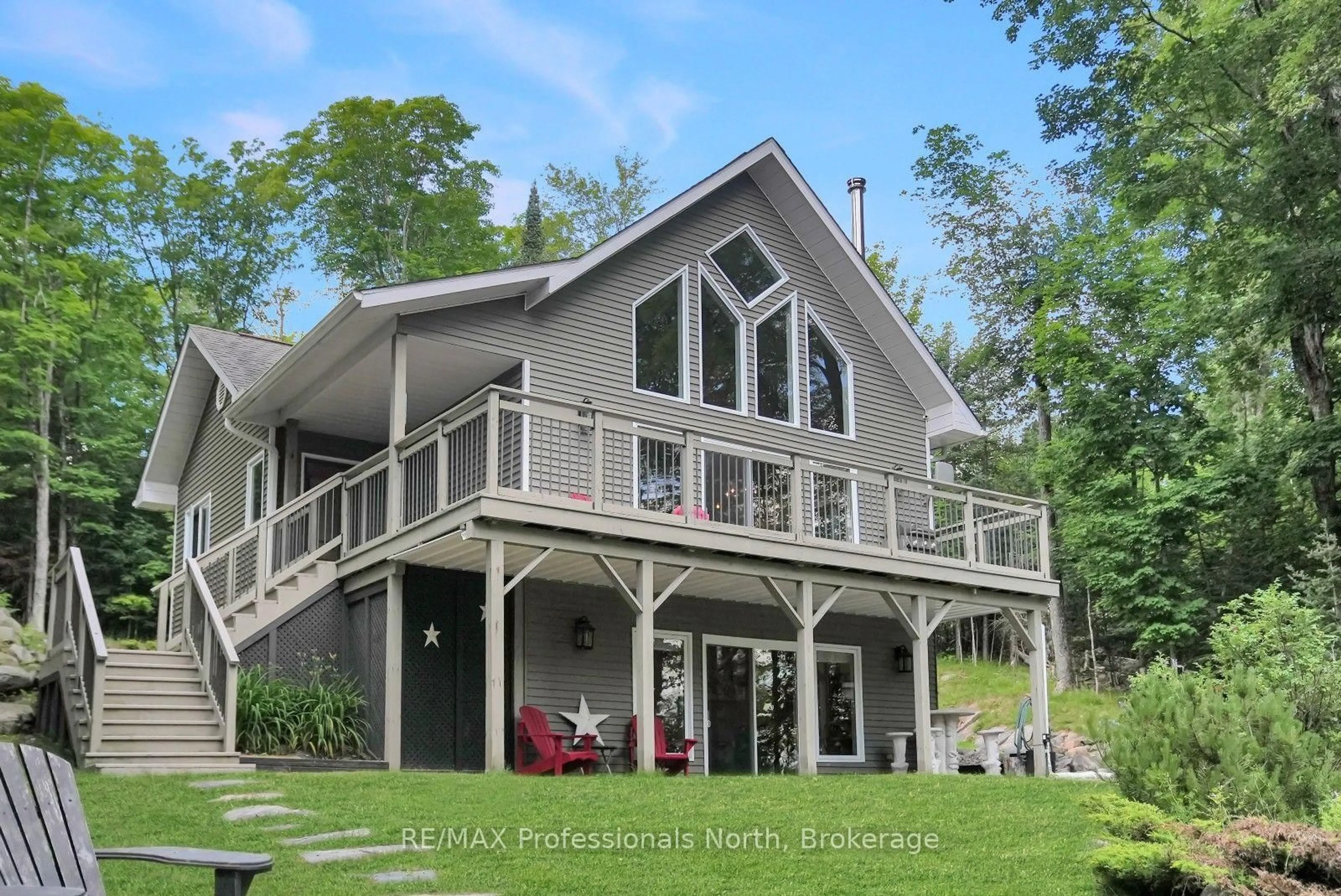 Home with vinyl exterior material, water/lake/river/ocean view for 1311 Wonderland Rd, Dysart et al Ontario K0M 1S0