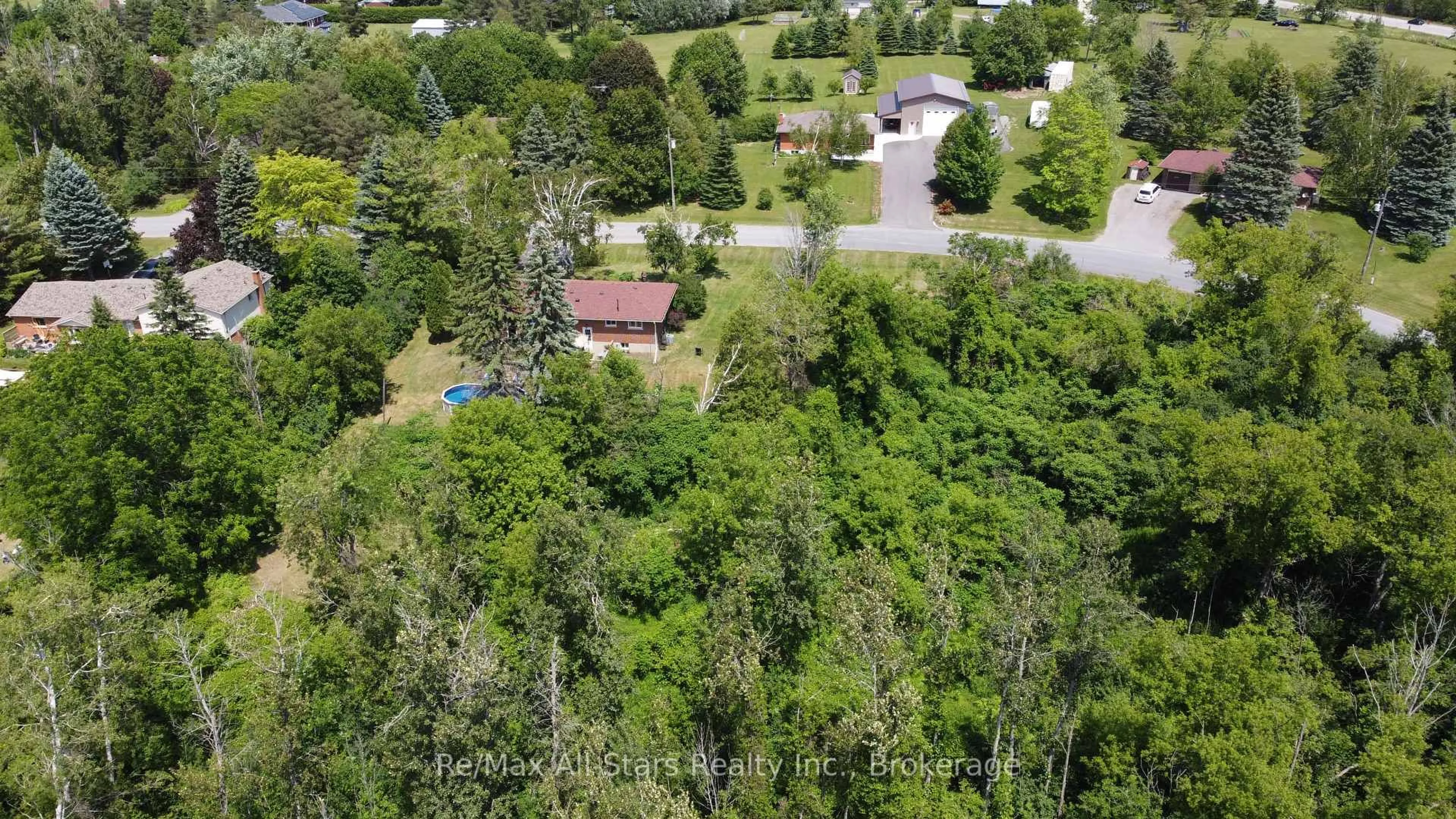 A pic from outside/outdoor area/front of a property/back of a property/a pic from drone, forest/trees view for 14 Valley Rd, Cavan Monaghan Ontario L0A 1G0