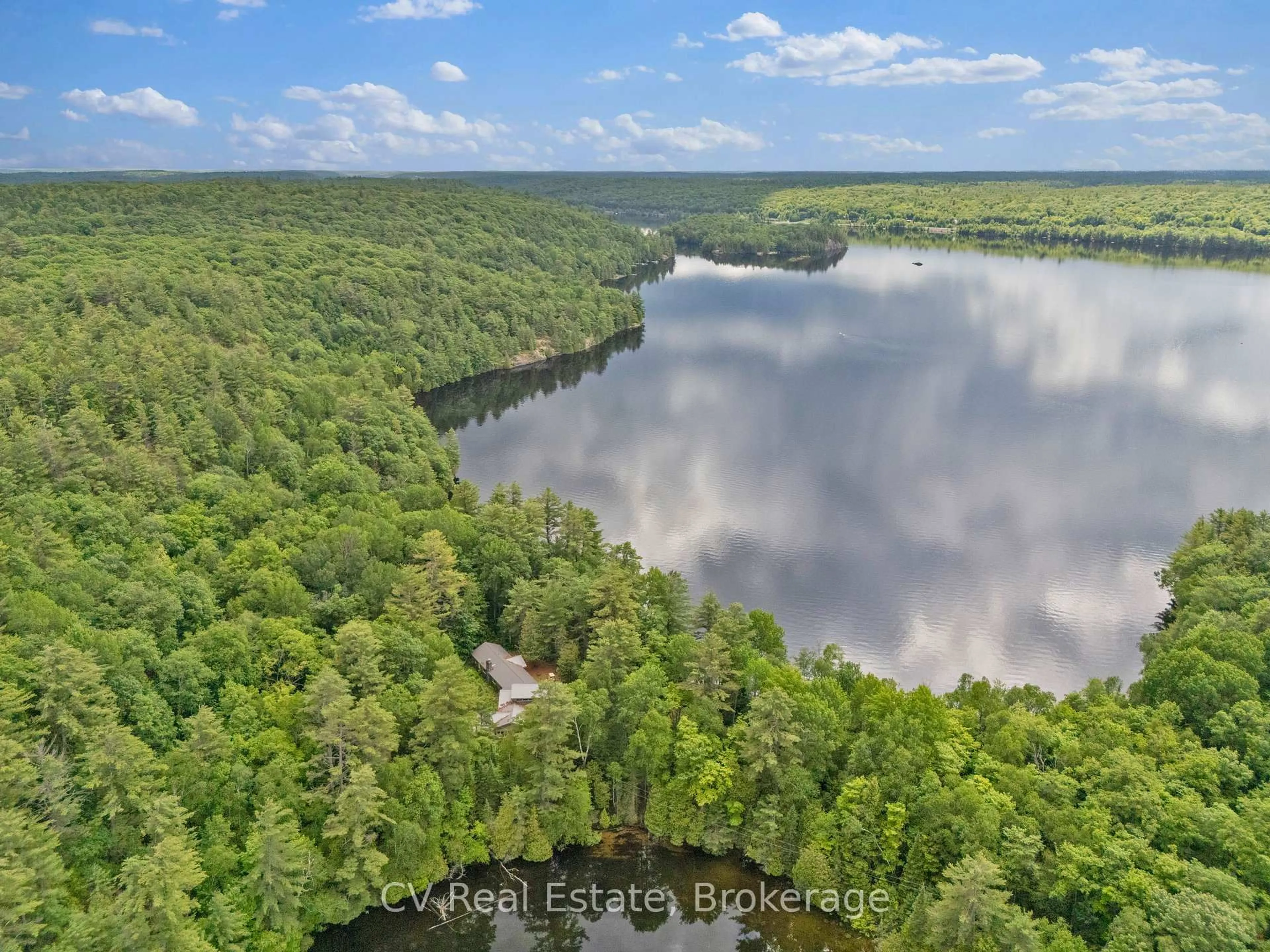 A pic from outside/outdoor area/front of a property/back of a property/a pic from drone, water/lake/river/ocean view for 11165 Kushog-North, Algonquin Highlands Ontario K0M 1J1