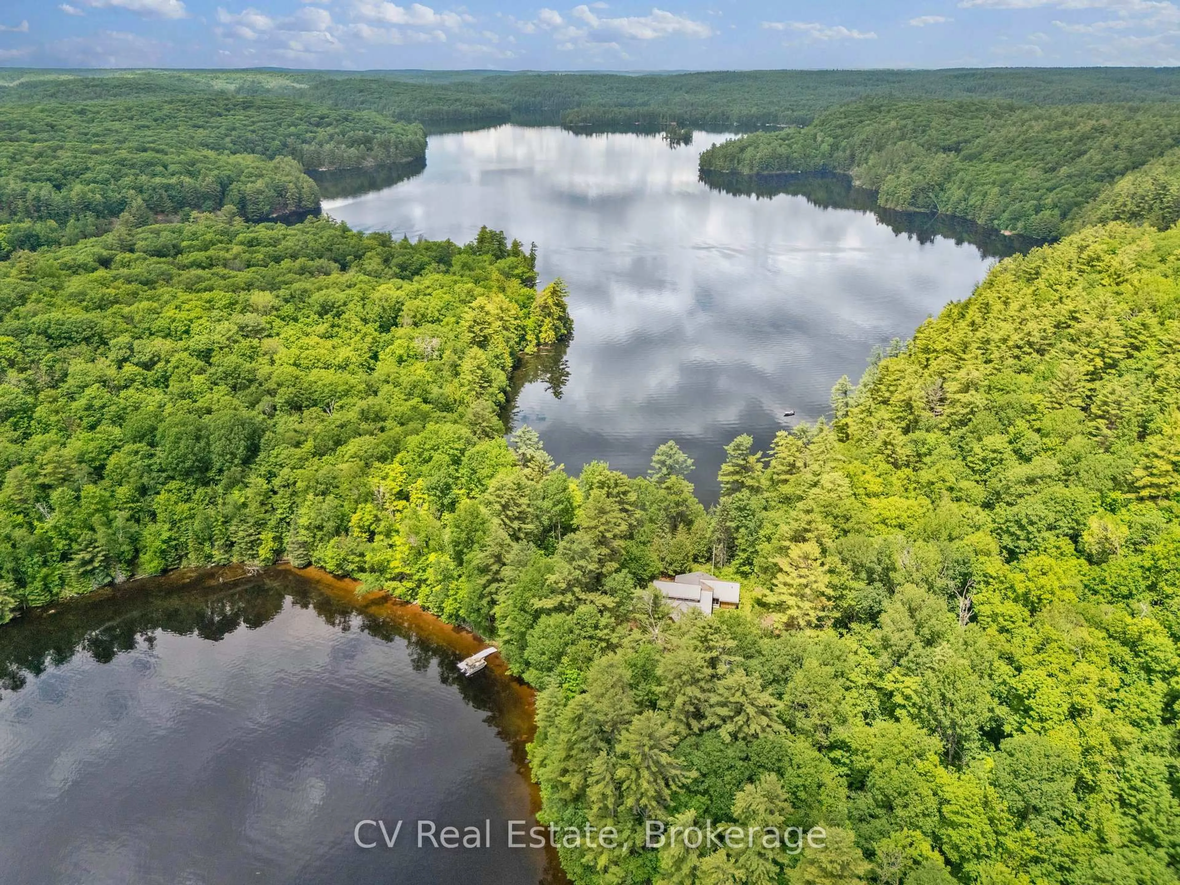 A pic from outside/outdoor area/front of a property/back of a property/a pic from drone, water/lake/river/ocean view for 11165 Kushog-North, Algonquin Highlands Ontario K0M 1J1